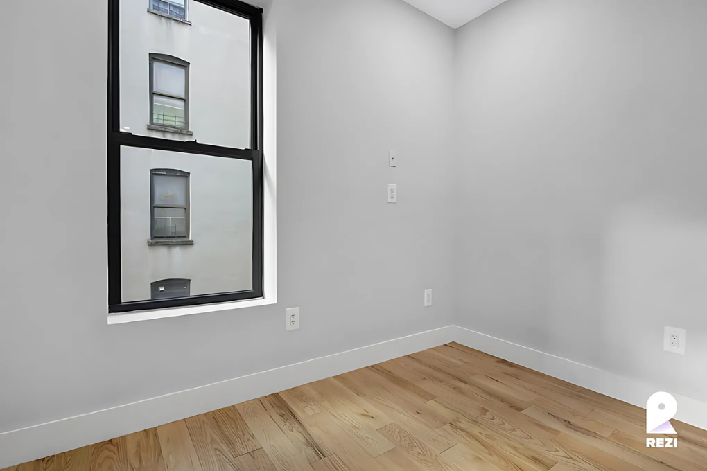 175 East 105th Street, Unit 3R Manhattan, NY 10029 - Photo 6 of 8 a view of a small space with wooden floor and cabinet