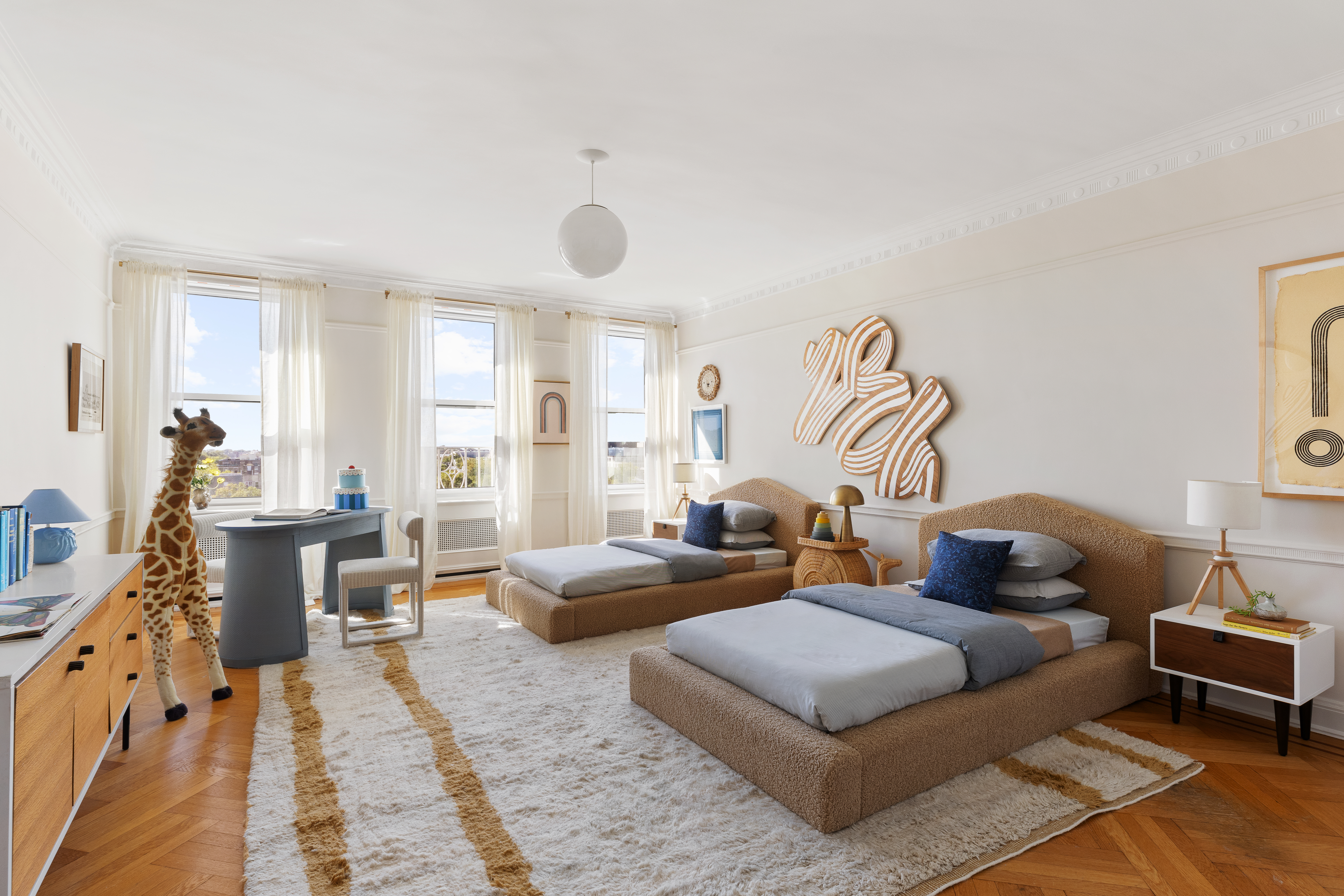 35 Prospect Park West, Unit 10B Brooklyn, NY 11215 - Photo 12 of 19 a living room with furniture and a wooden floor