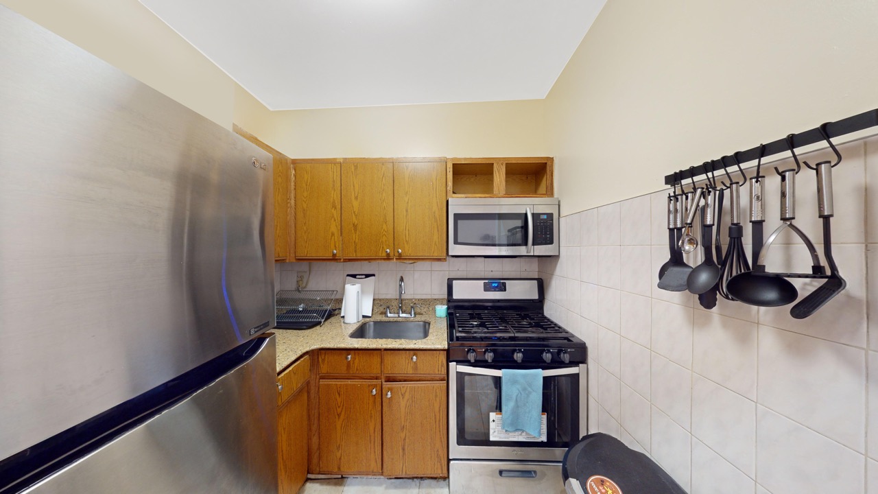 495 Central Avenue, Unit 2 Brooklyn, NY 11221 - Photo 6 of 19 a kitchen with stainless steel appliances granite countertop a stove and a sink