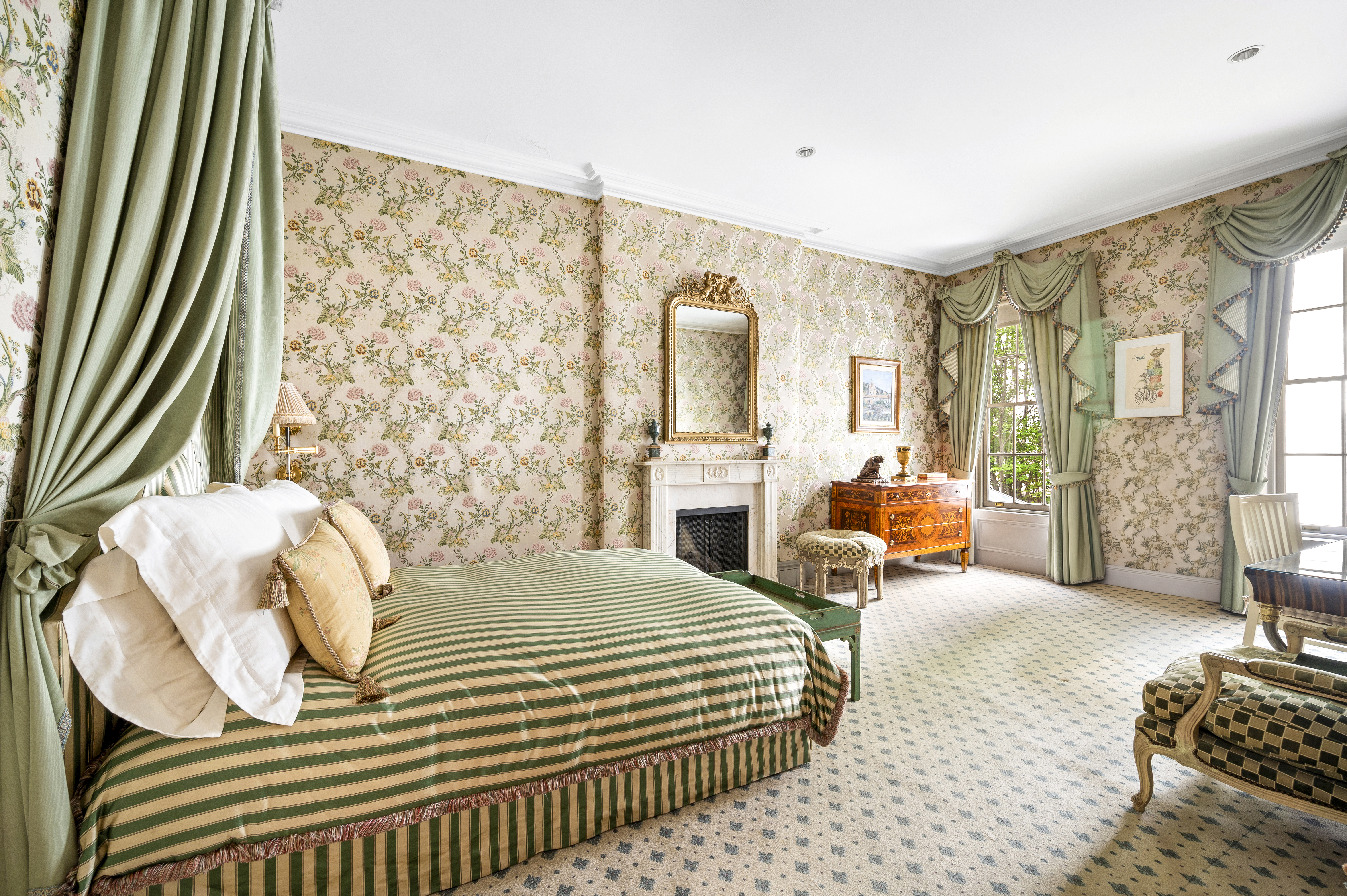 163 East 64th Street Manhattan, NY 10065 - Photo 22 of 34 a bedroom with a bed couch and a large window