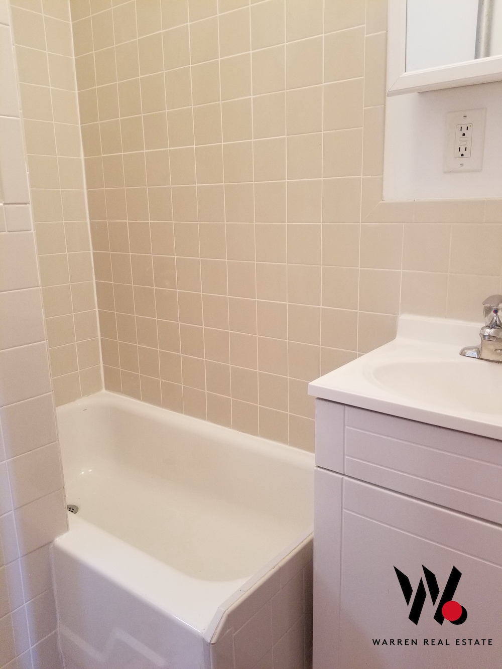 80 East 7th Street, Unit 5B Manhattan, NY 10003 - Photo 7 of 8 a bath tub sitting next to a white sink