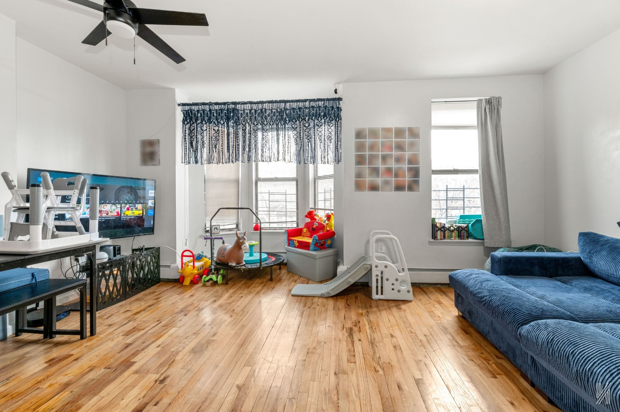 426 54th Street Brooklyn, NY 11220 - Photo 2 of 22 a living room with furniture and a large window