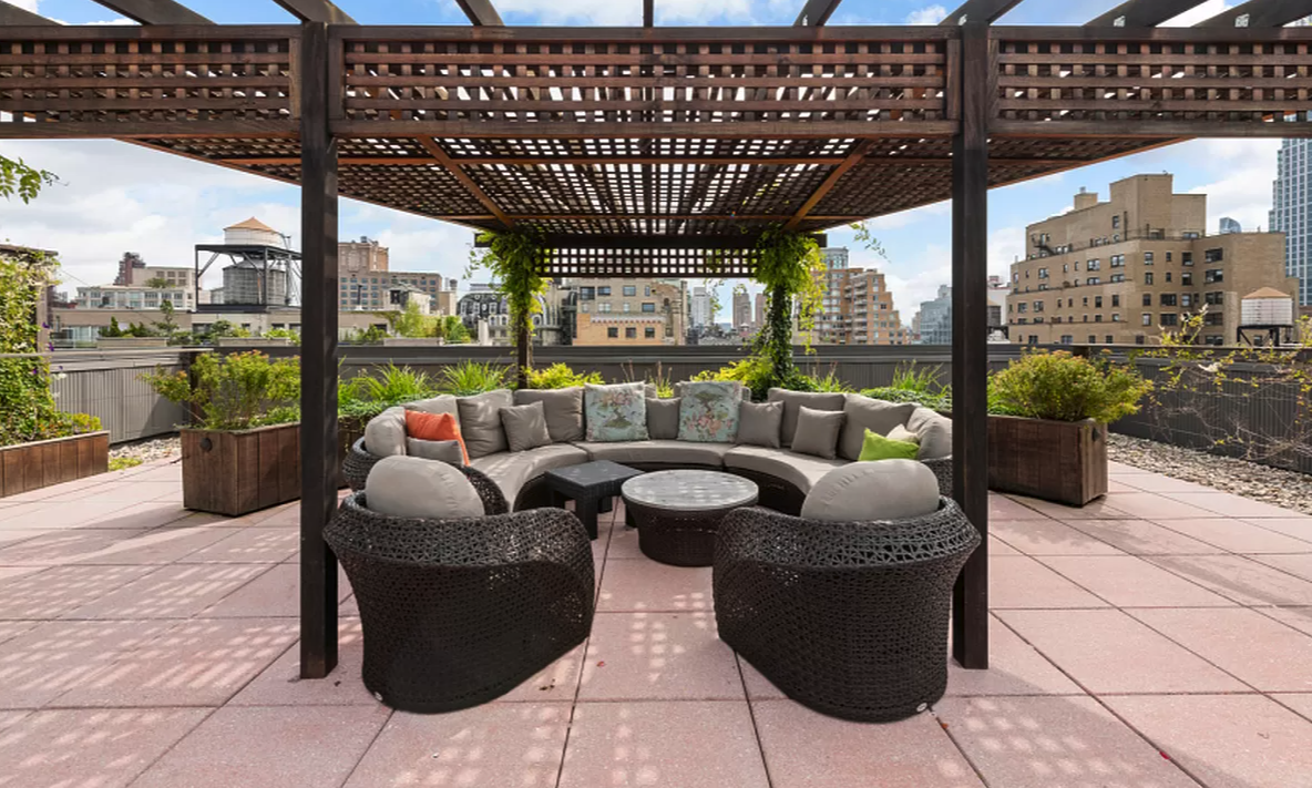 11 Riverside Drive, Unit 9SE Manhattan, NY 10023 - Photo 10 of 13 a living room with patio furniture and a potted plant