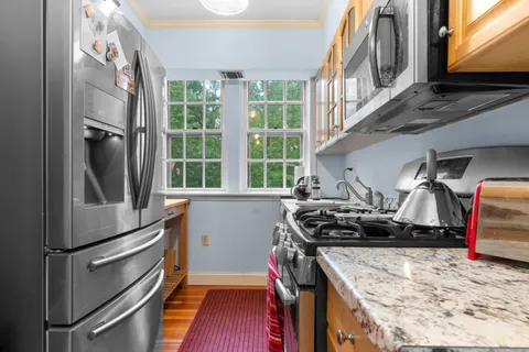 a kitchen with a stove and a sink