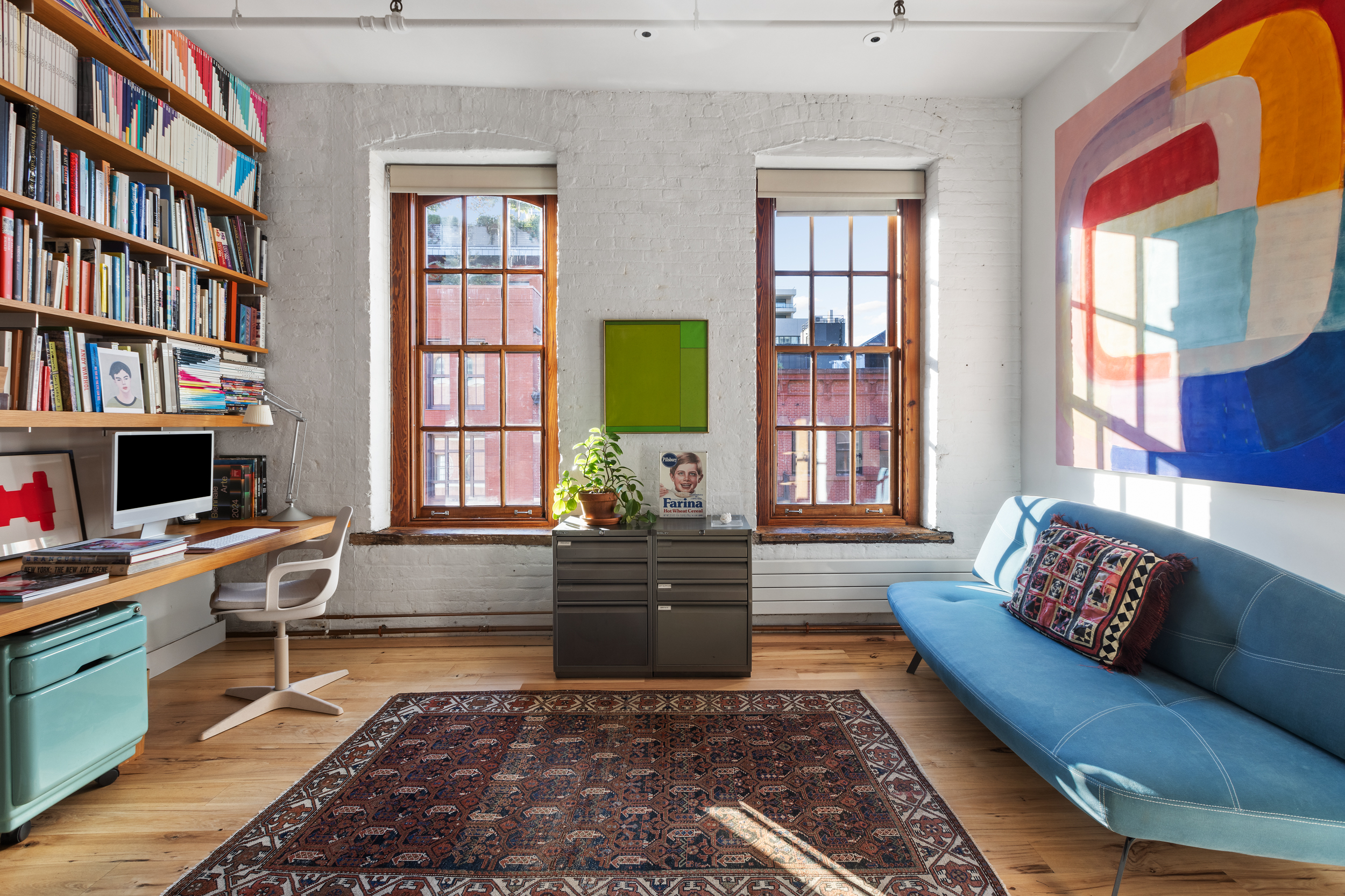 463 Greenwich Street Manhattan, NY 10013 - Photo 11 of 24 a living room with furniture and a window