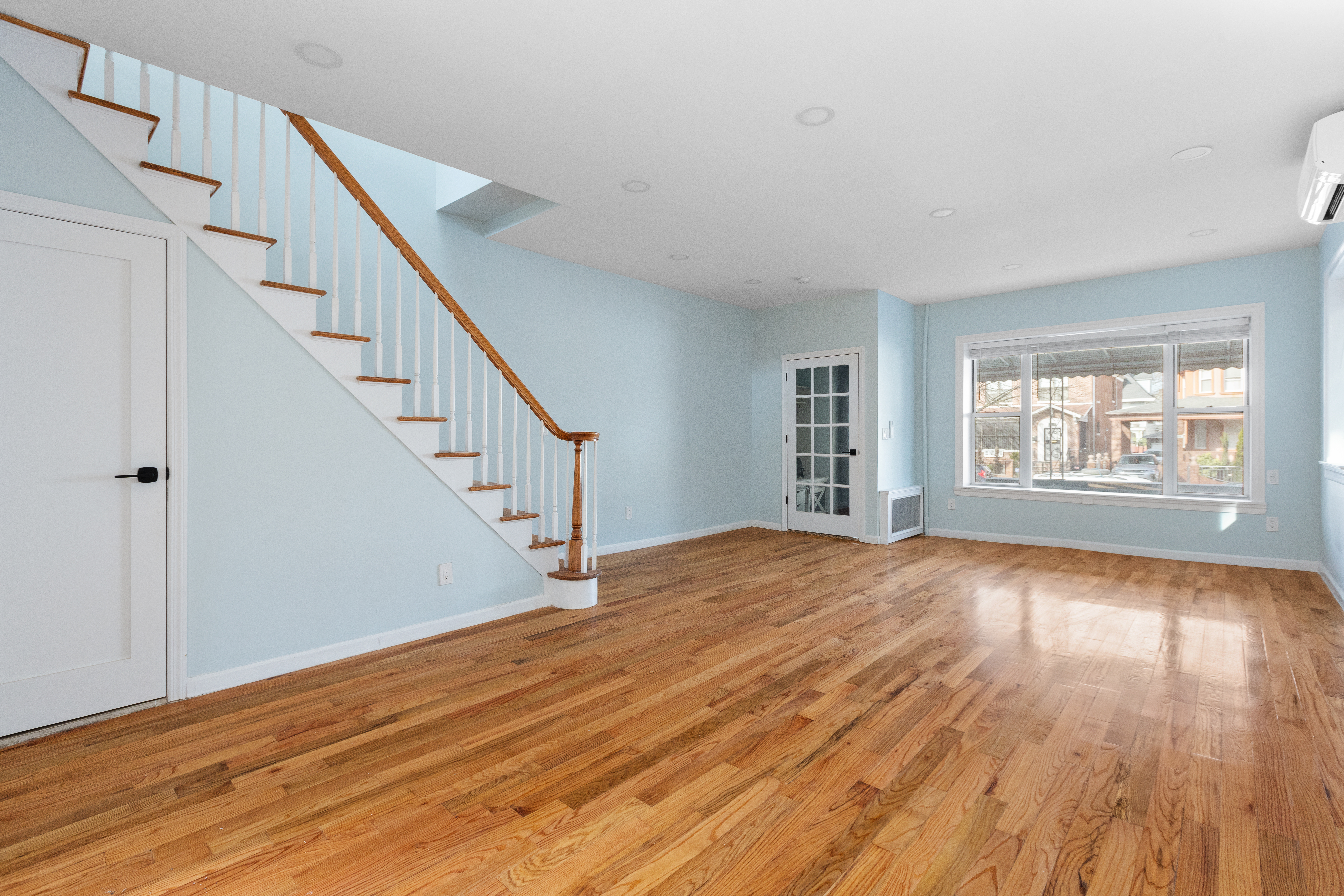 2773 Bedford Avenue Brooklyn, NY 11210 - Photo 2 of 17 a view of empty room with wooden floor and fan