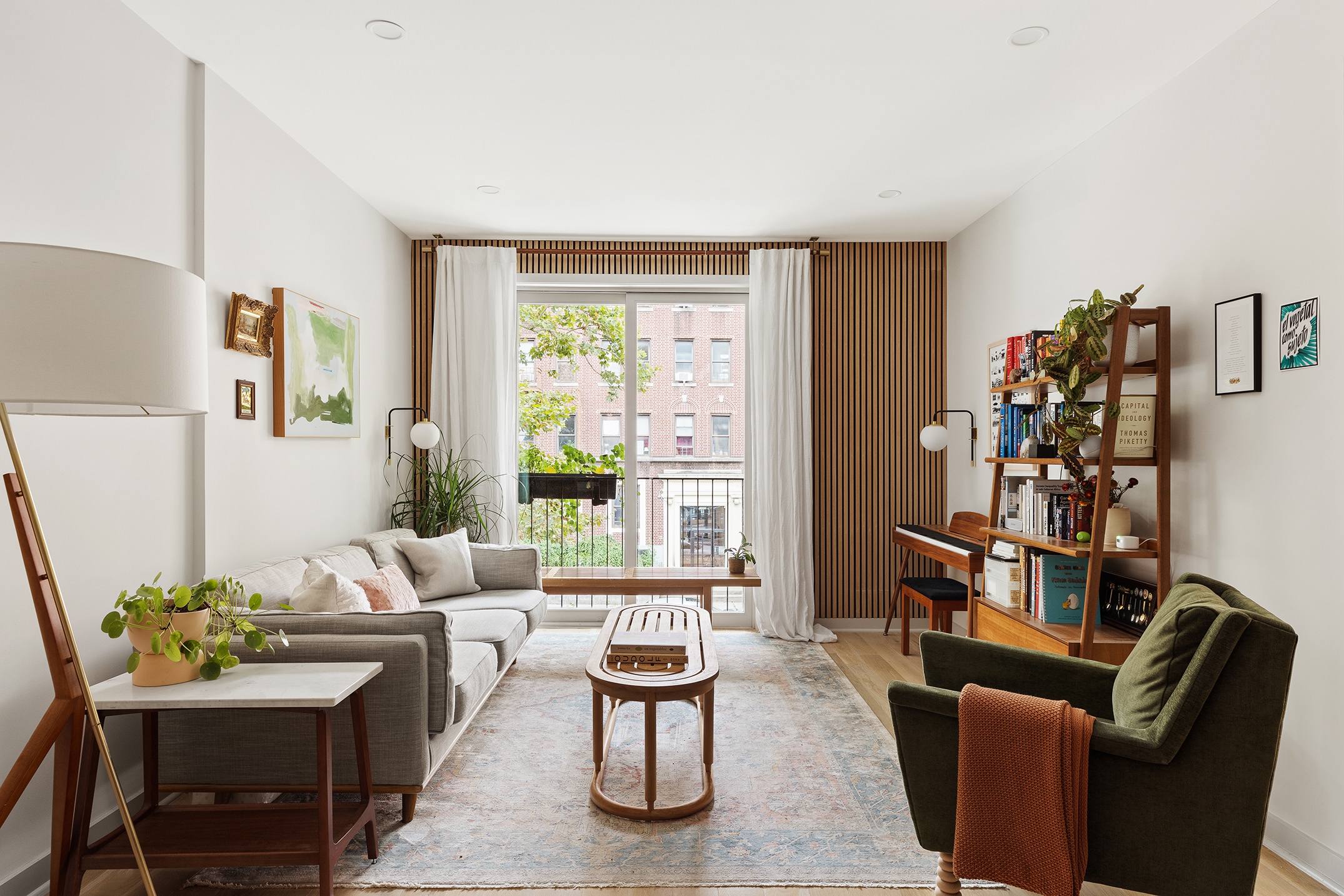 a living room with furniture fireplace and a window