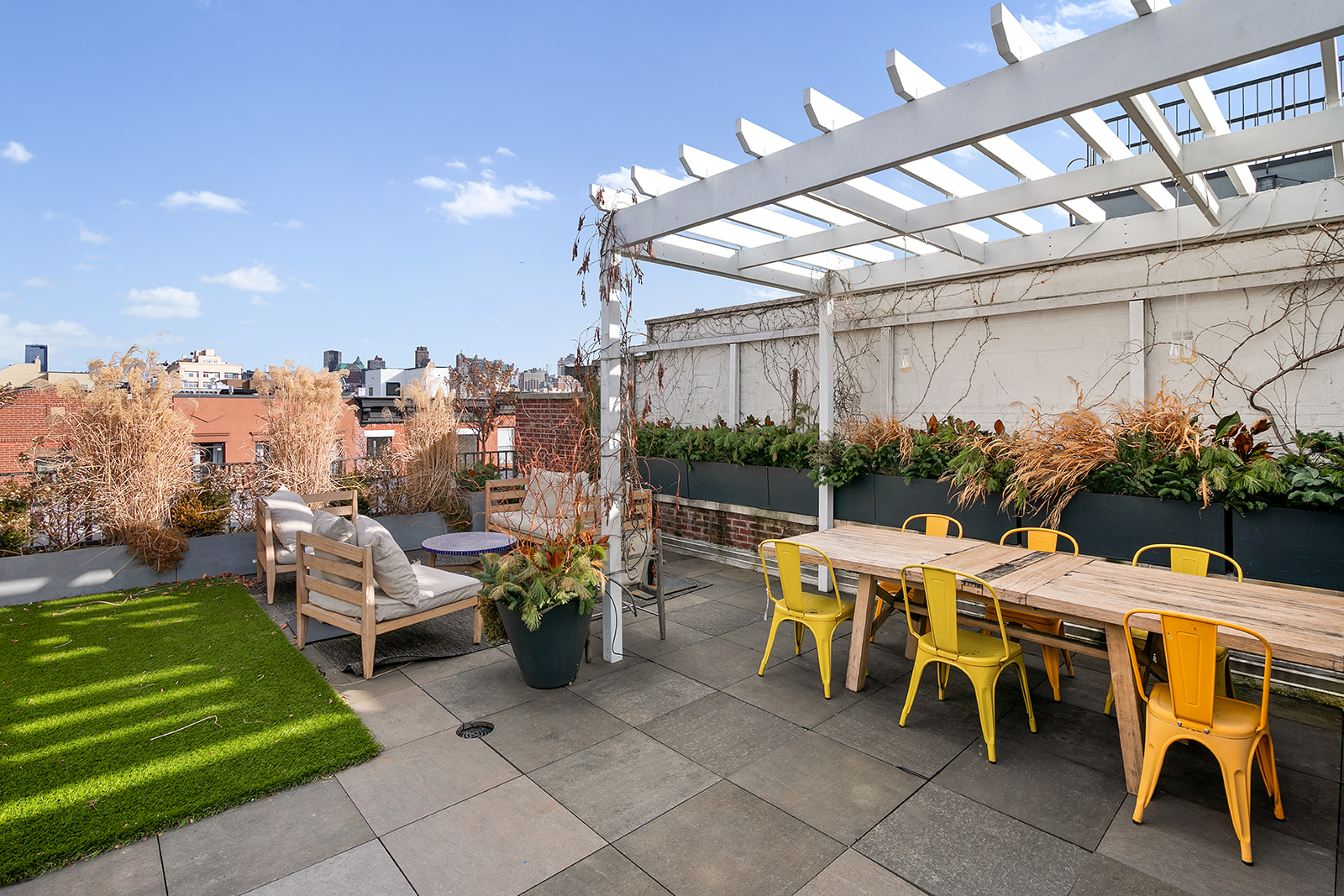 110 President Street, Unit 2 Brooklyn, NY 11231 - Photo 1 of 15 a view of a patio with table and chairs potted plants with wooden floor