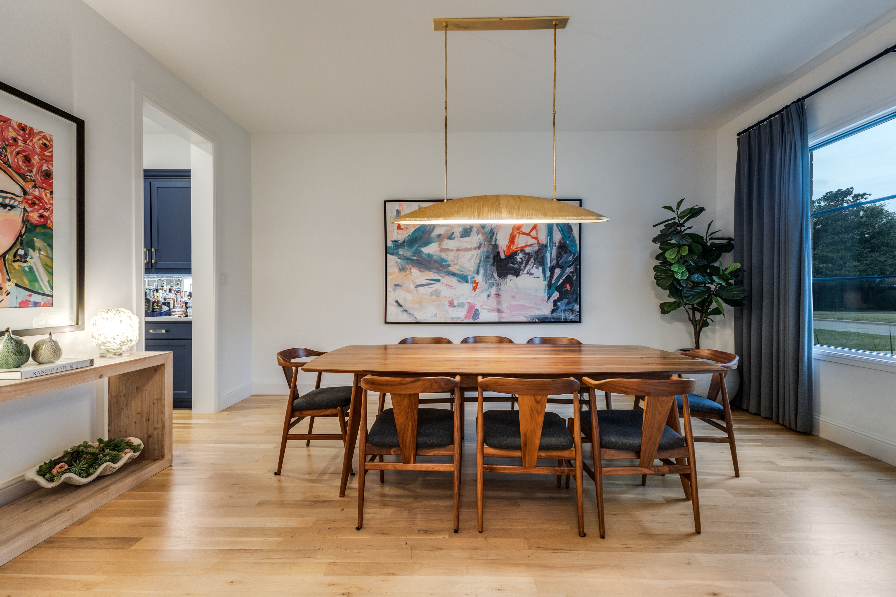 4042 Dunhaven Road Dallas, TX 75220 - Photo 4 of 34 a dining room with furniture a rug and a painting