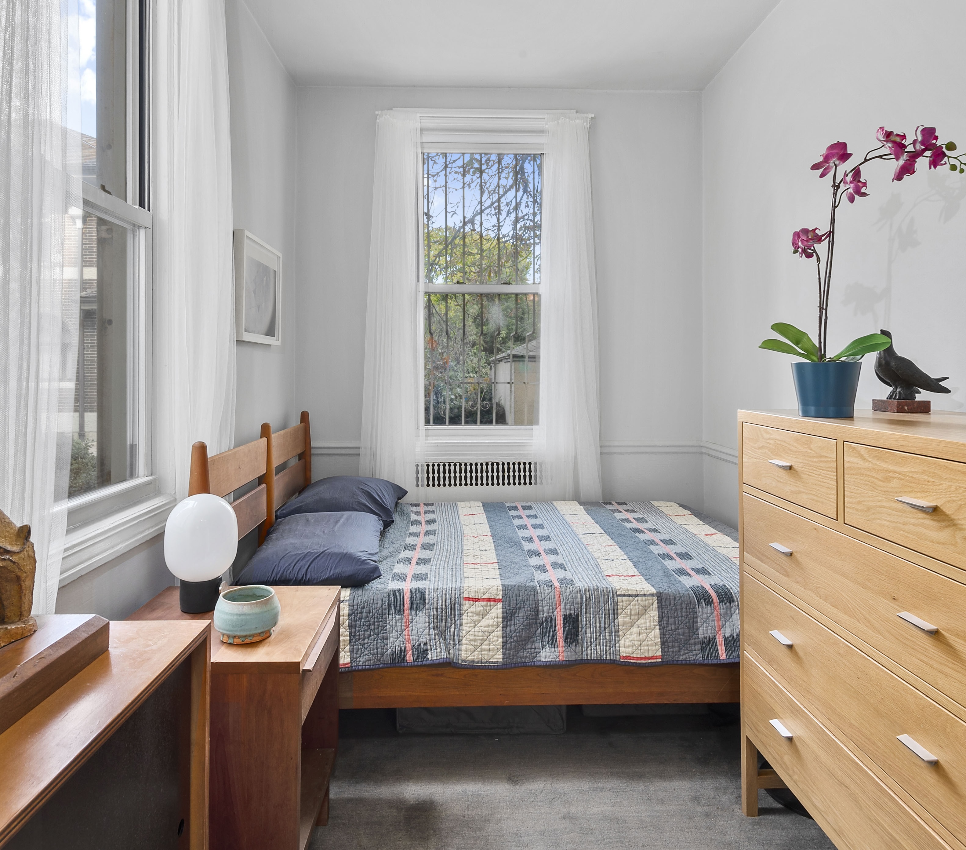 1409 Albemarle Road, Unit 1H Brooklyn, NY 11226 - Photo 5 of 9 a bedroom with a bed and wooden floor