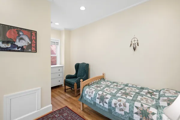 a bedroom with bed and a window