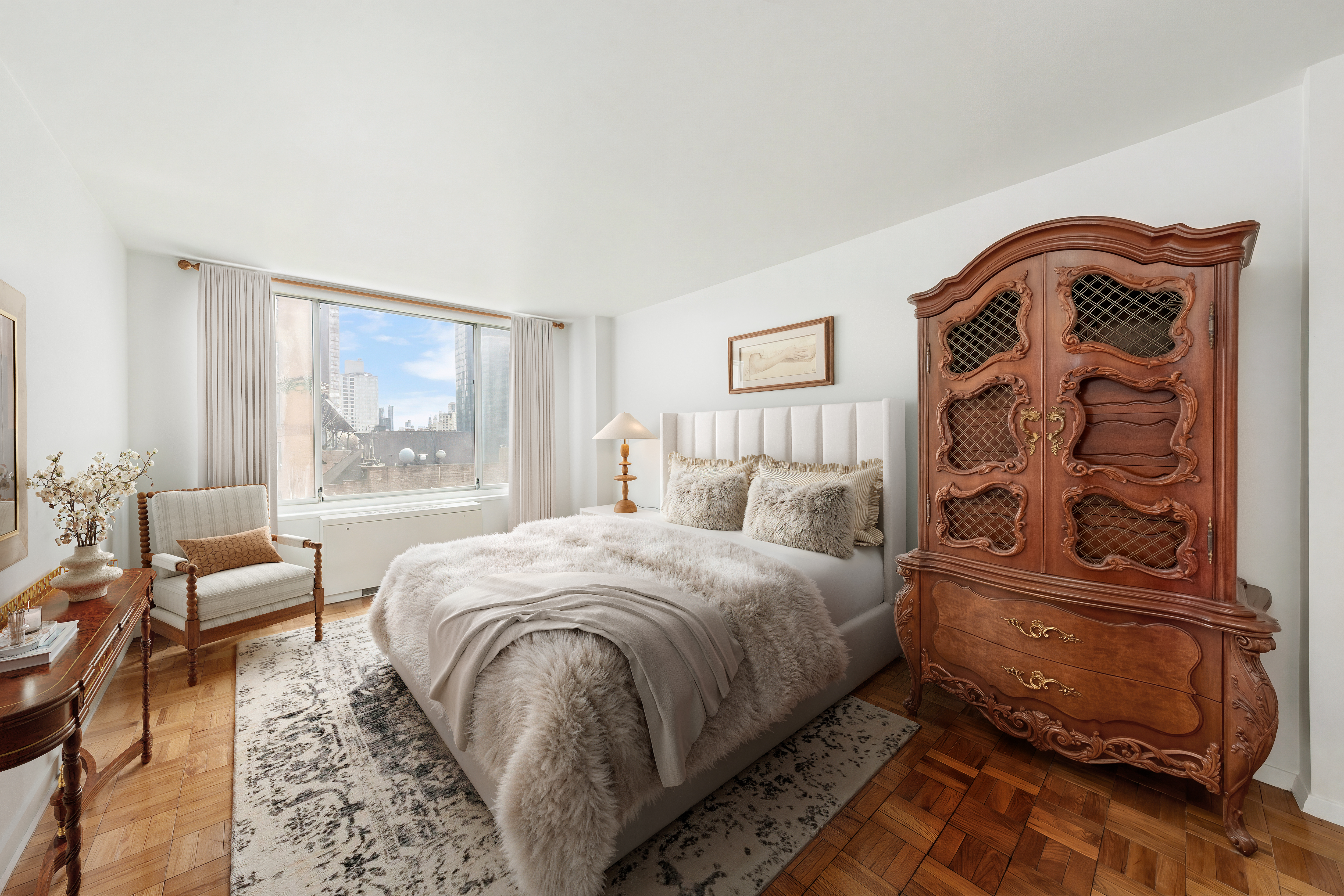 1160 3rd Avenue, Unit 15H Manhattan, NY 10065 - Photo 5 of 7 a bedroom with a bed and wooden floor