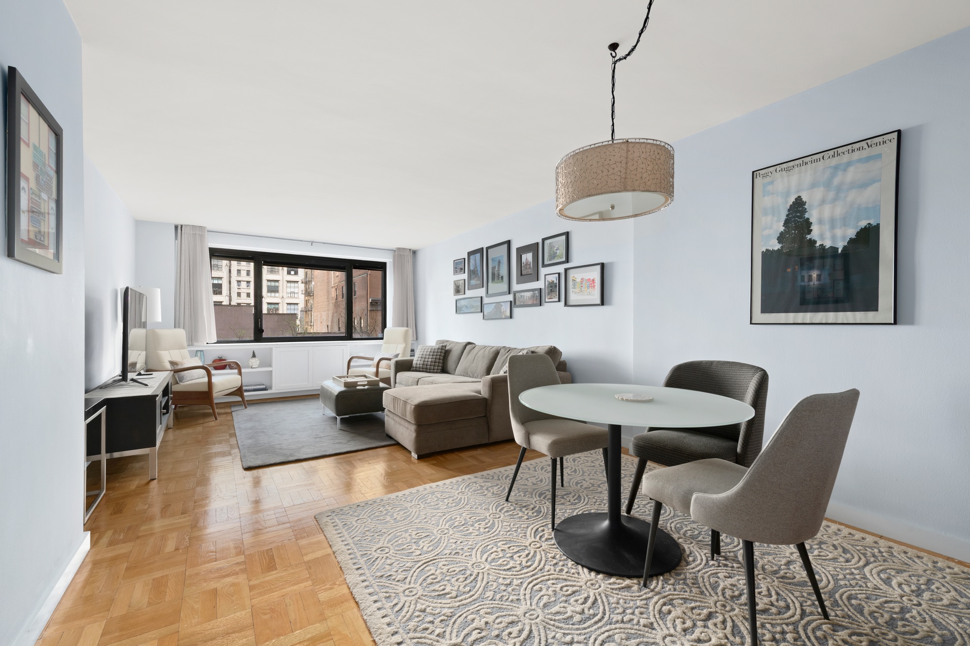 10 West 66th Street, Unit 7C Manhattan, NY 10023 - Photo 2 of 19 a living room with furniture and a window