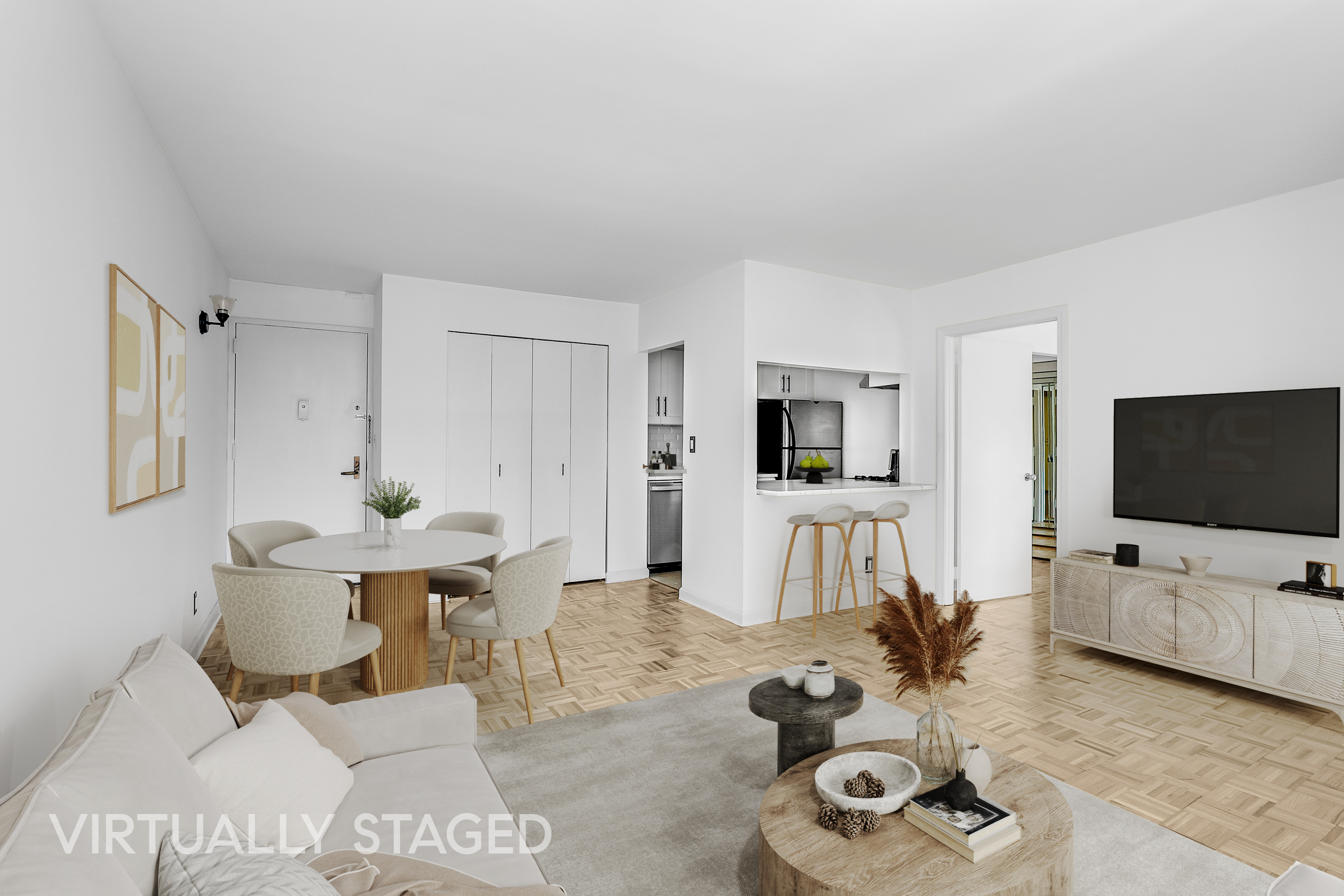 400 East 70th Street, Unit 1008 Manhattan, NY 10021 - Photo 4 of 15 a living room with furniture and a flat screen tv