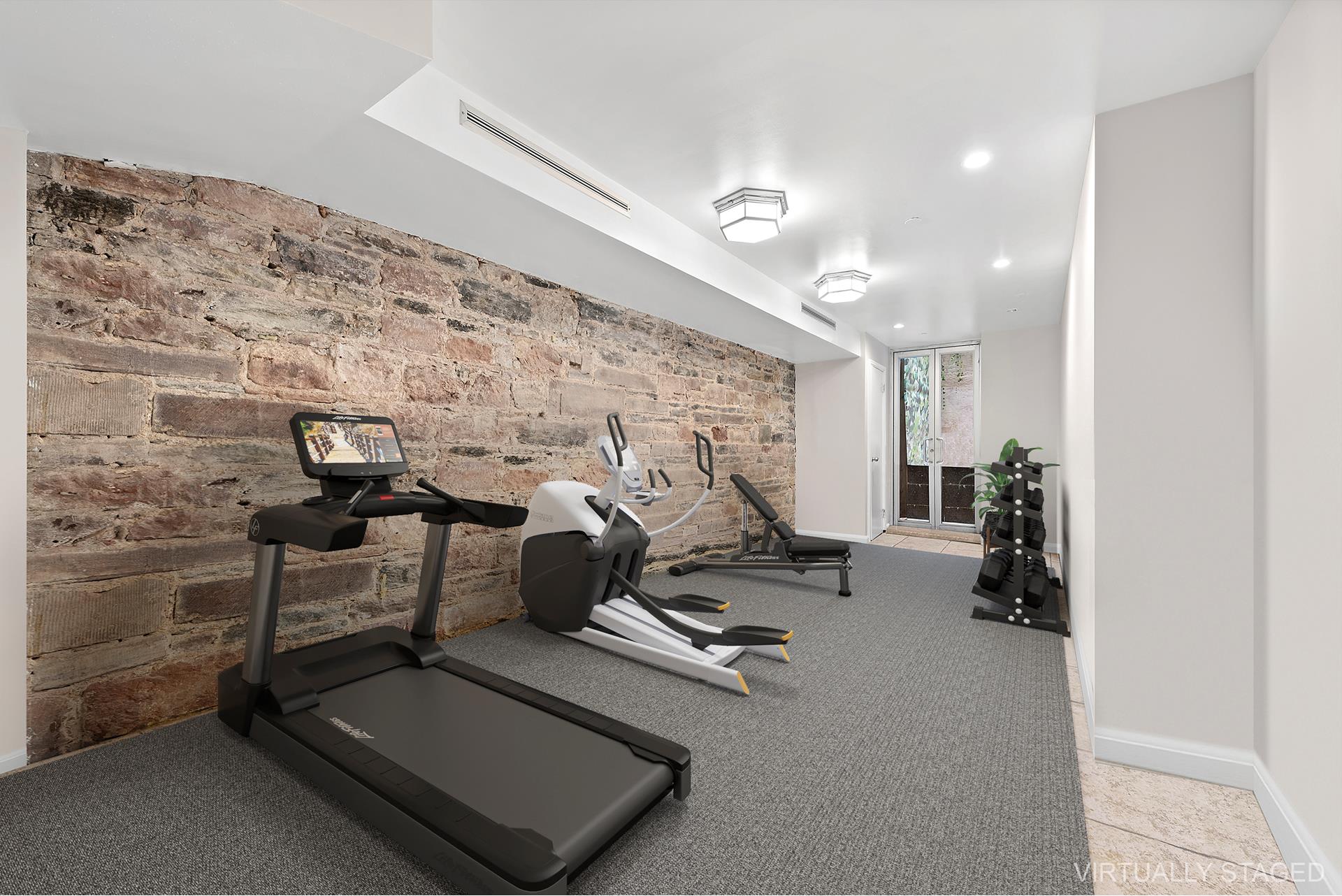 53 Murray Street, Unit 1 Manhattan, NY 10007 - Photo 14 of 15 a view of a room with gym equipment