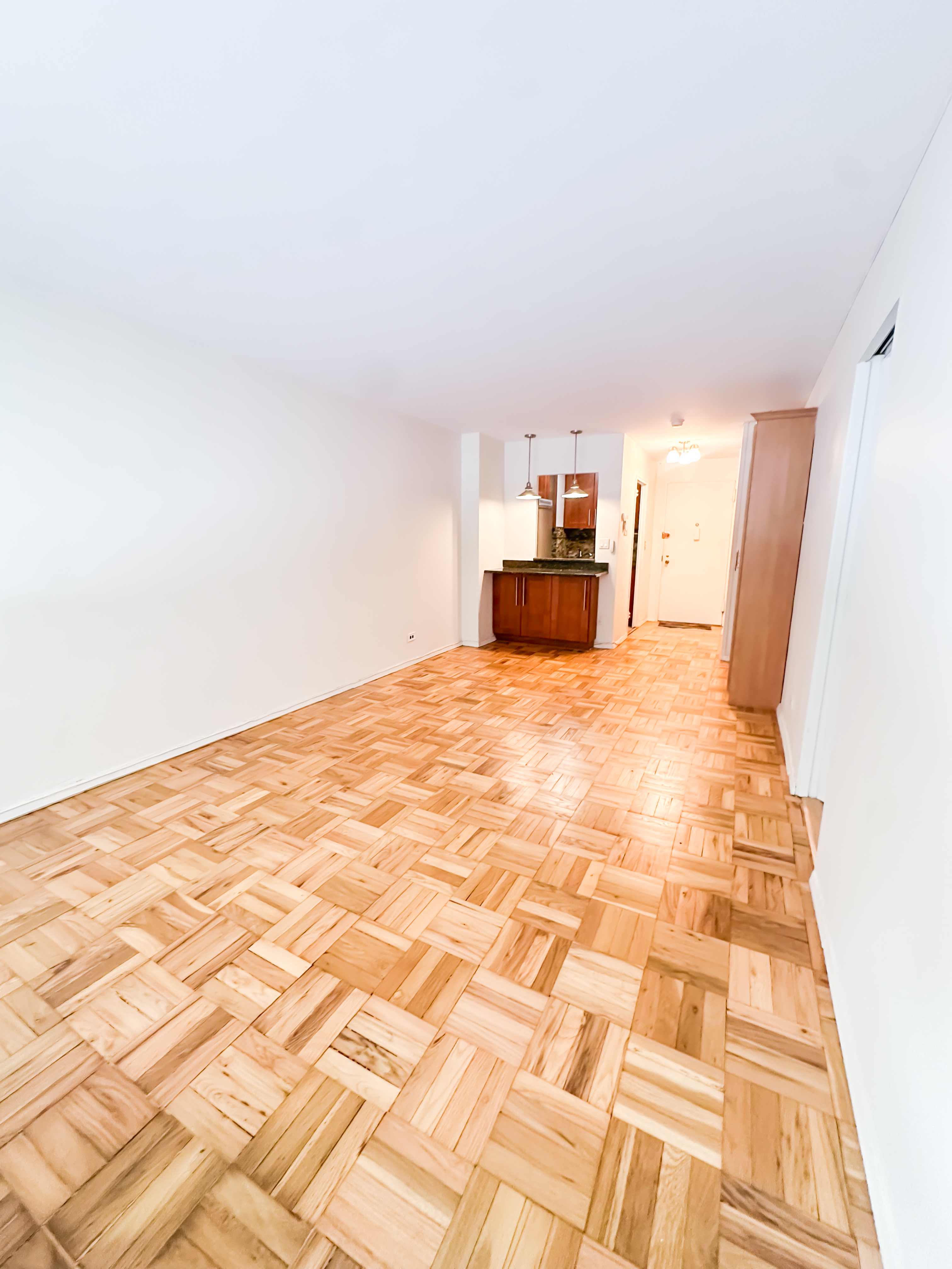 301 East 22nd Street, Unit 2H Manhattan, NY 10010 - Photo 5 of 16 a large white bed in a white room