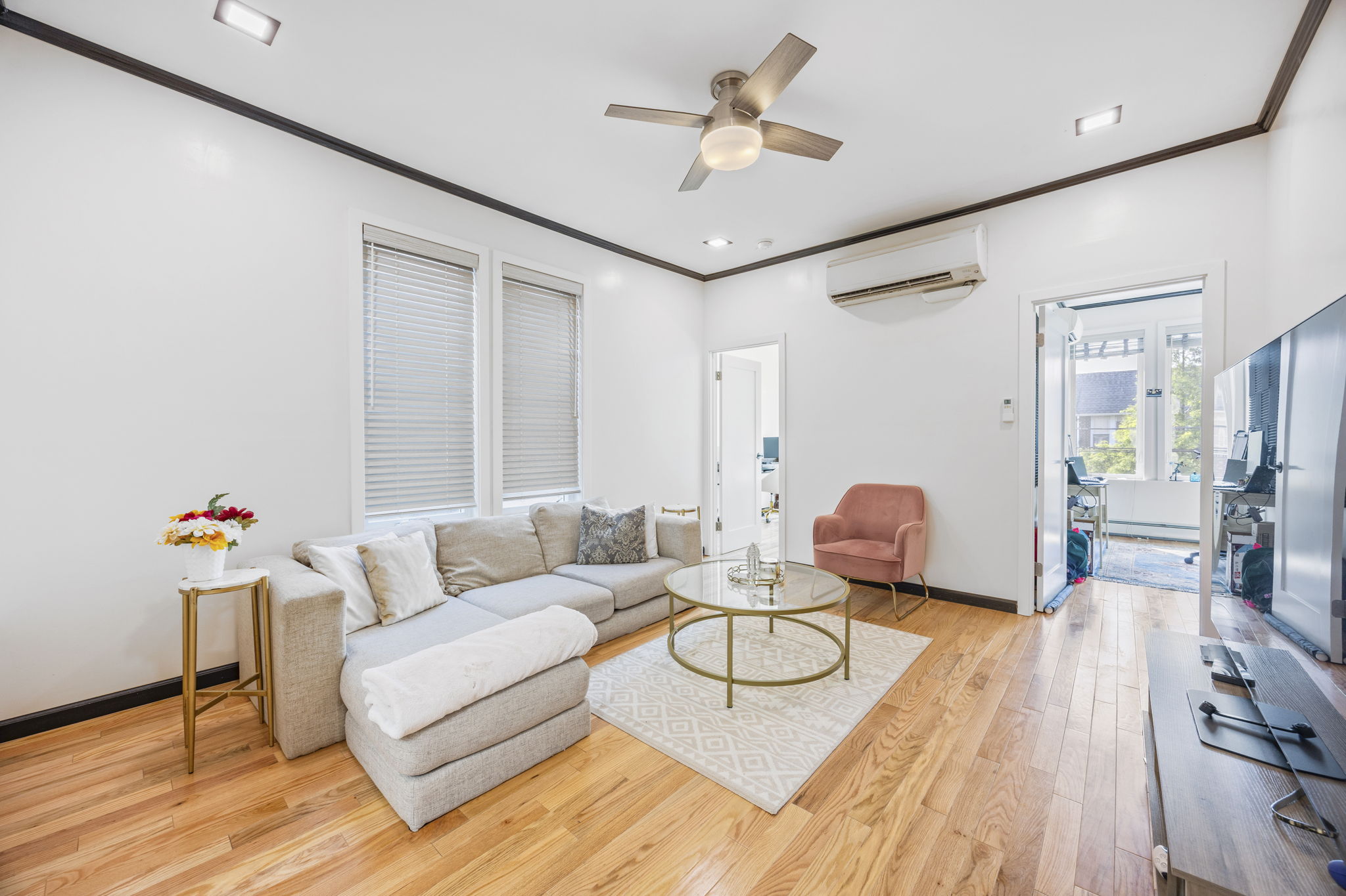 25-69 46th Street Queens, NY 11103 - Photo 11 of 33 a living room with furniture and wooden floor
