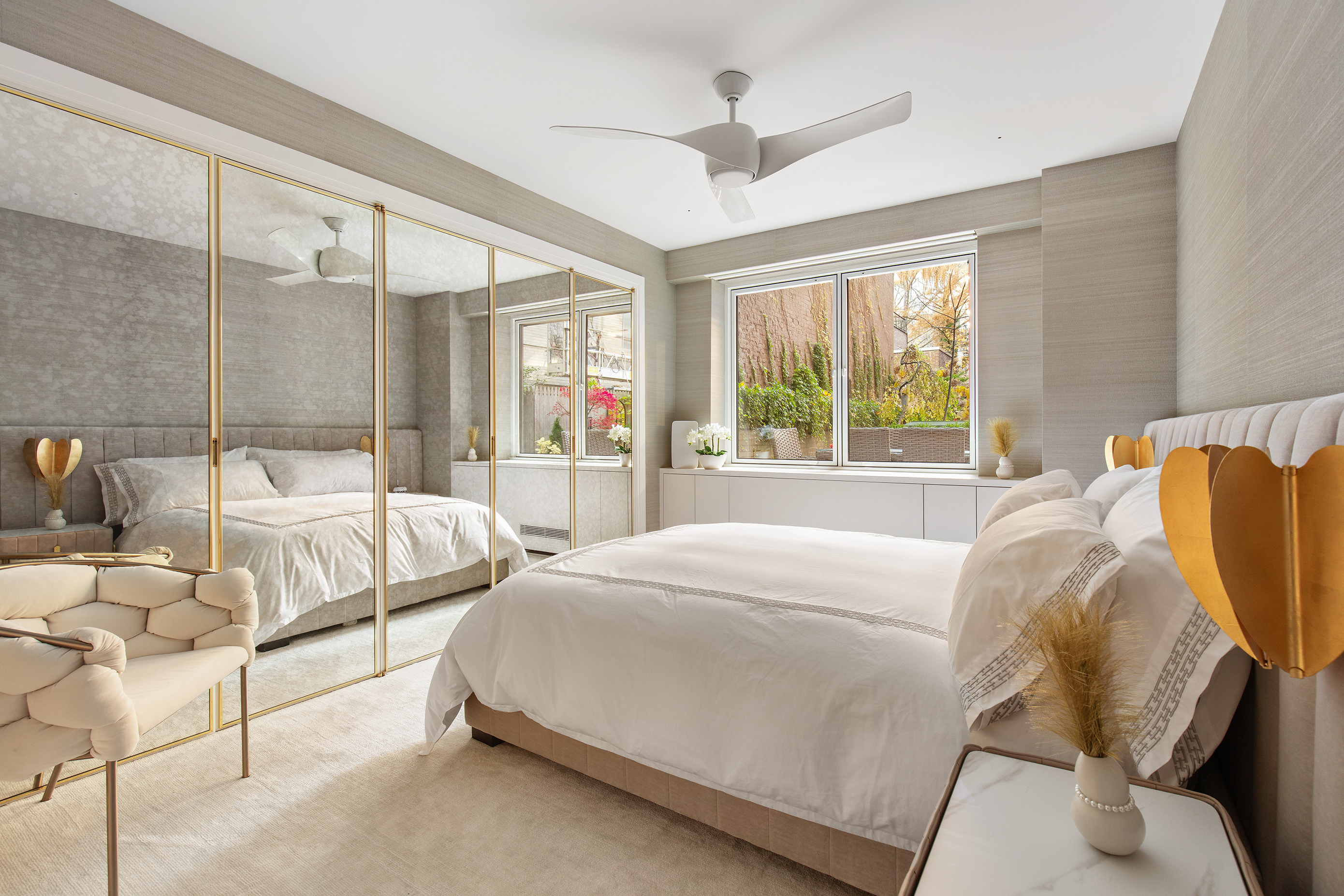 923 5th Avenue, Unit 2A Manhattan, NY 10021 - Photo 8 of 14 a spacious bedroom with a bed and large window