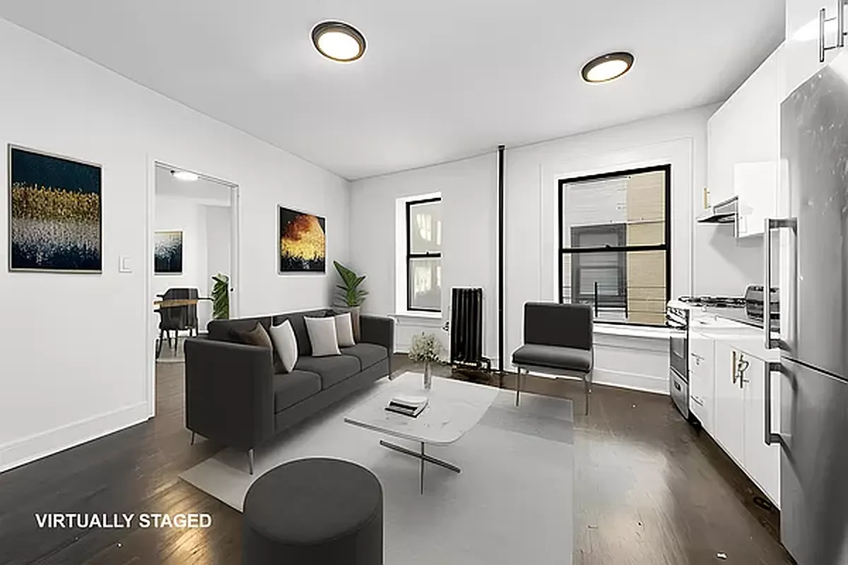a living room with furniture window and wooden floor