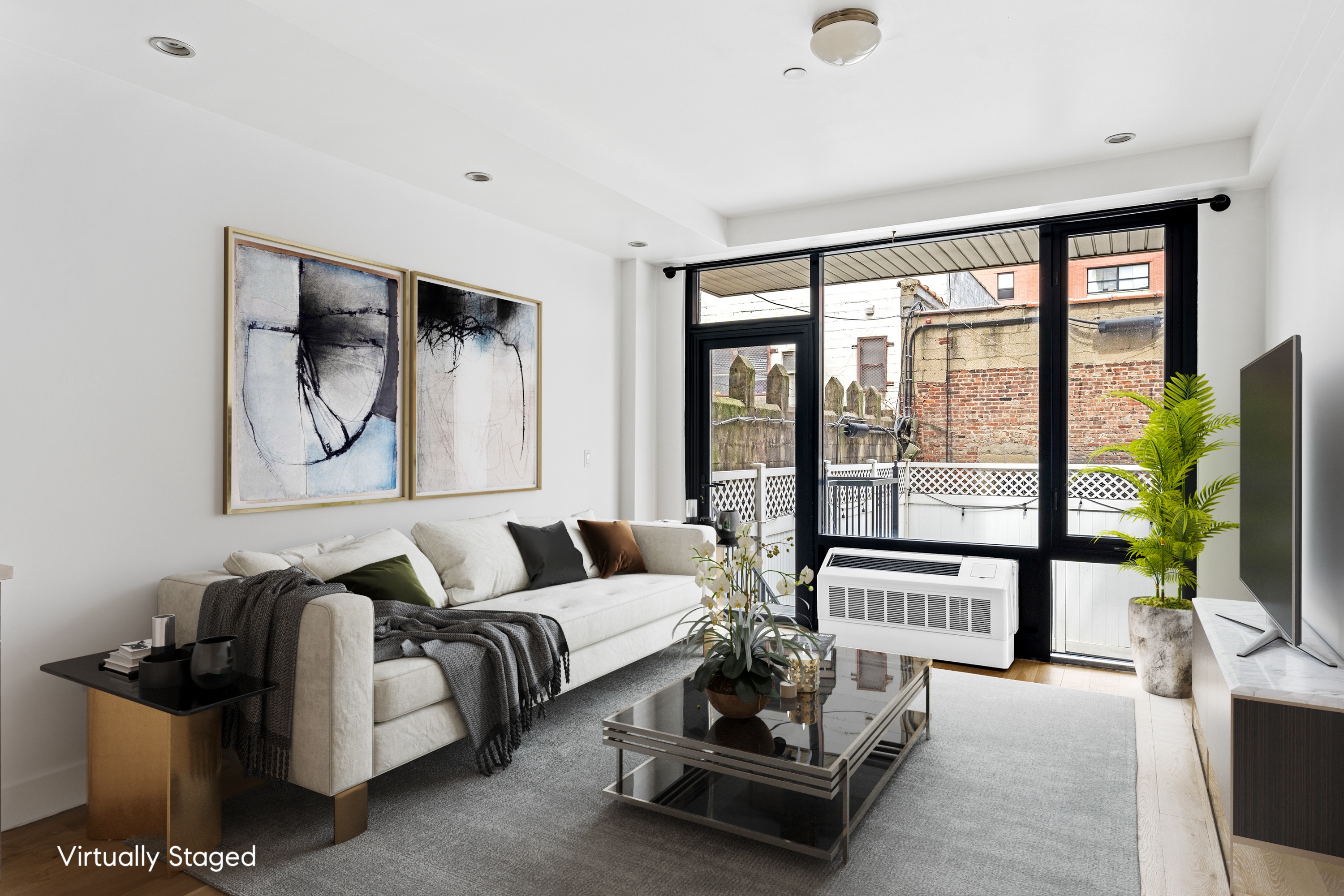 399 East 8th Street, Unit 1A Manhattan, NY 10009 - Photo 3 of 13 a living room with furniture and a floor to ceiling window