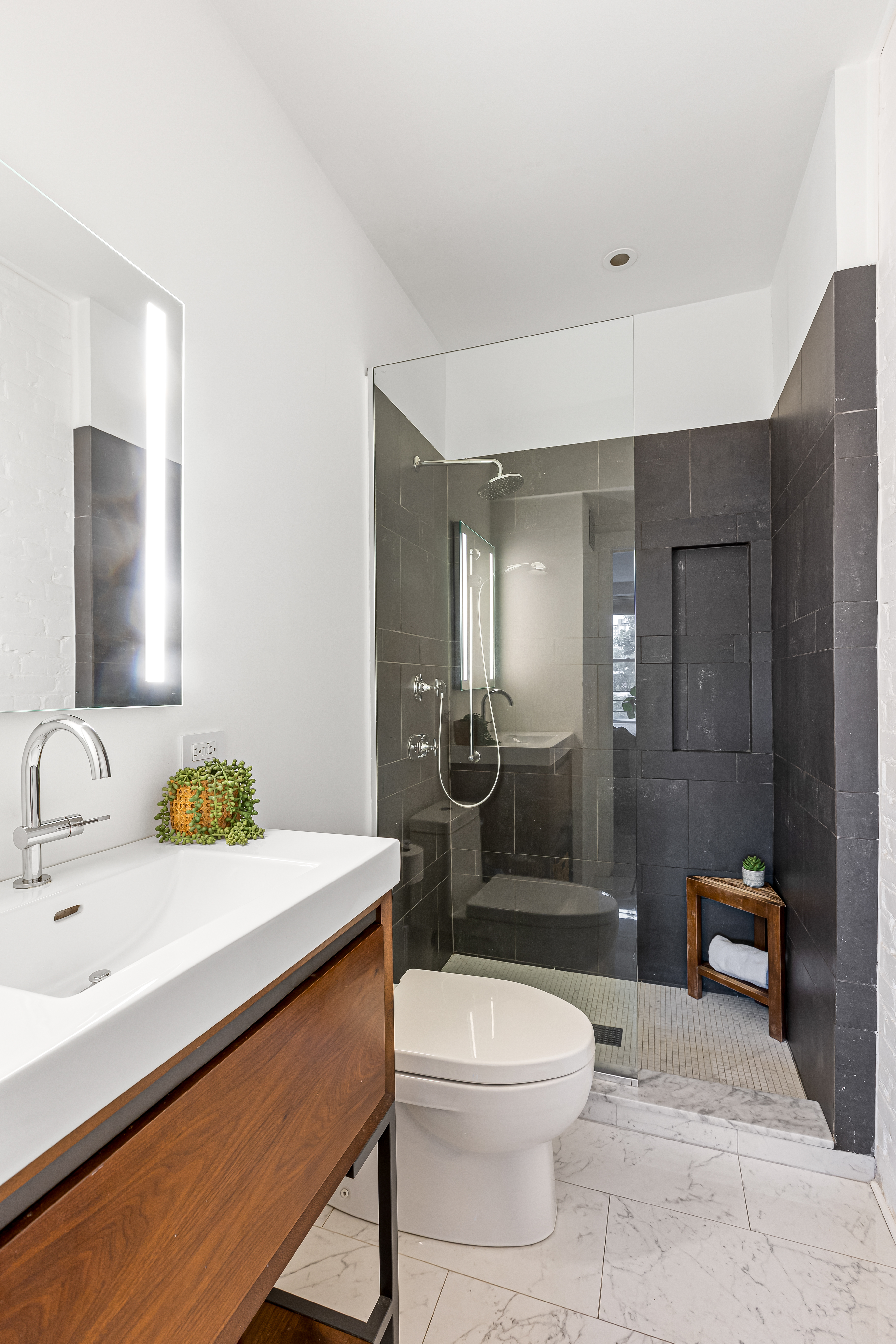 277 Hicks Street, Unit 4D Brooklyn, NY 11201 - Photo 9 of 15 a bathroom with a sink a toilet and shower