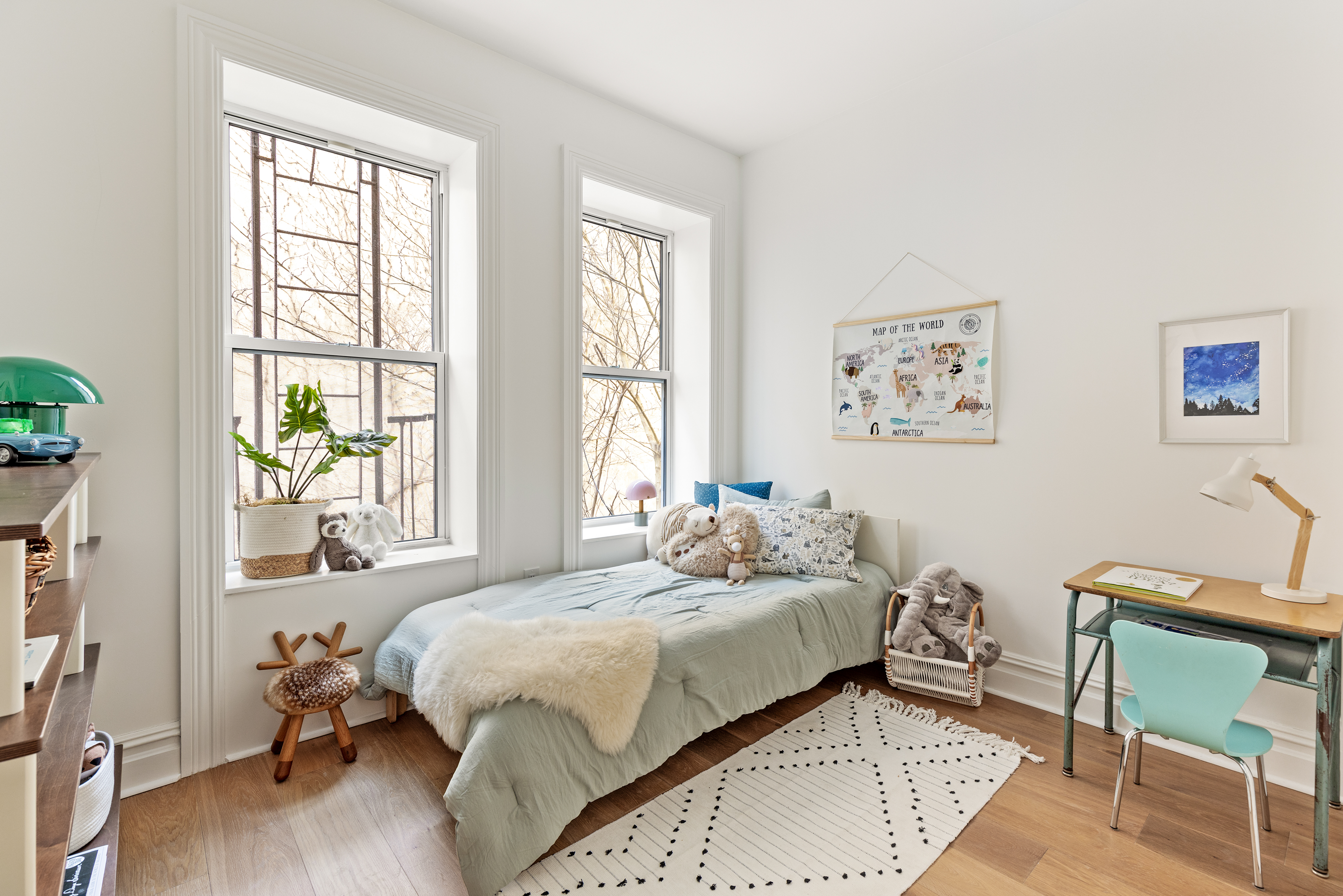 744 Park Place, Unit 1B Brooklyn, NY 11216 - Photo 5 of 15 a bedroom with a bed and a chair