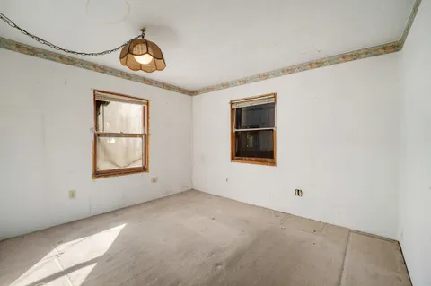 a bathroom with a sink toilet and a mirror