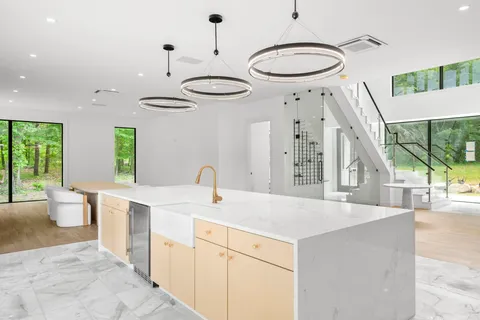 a kitchen with a stove a sink and a refrigerator
