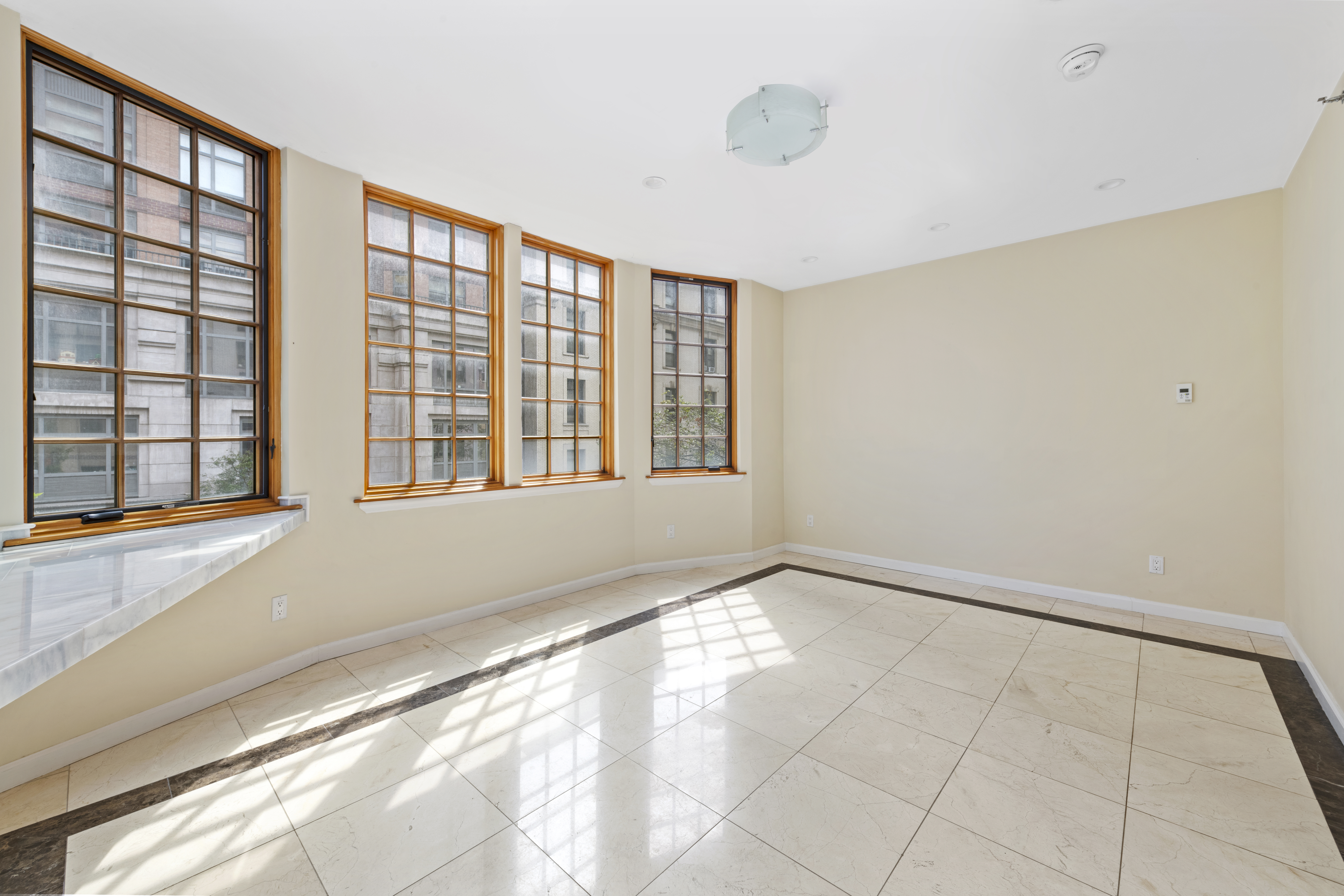 195 East 76th Street Manhattan, NY 10021 - Photo 15 of 20 a view of an empty room with a window