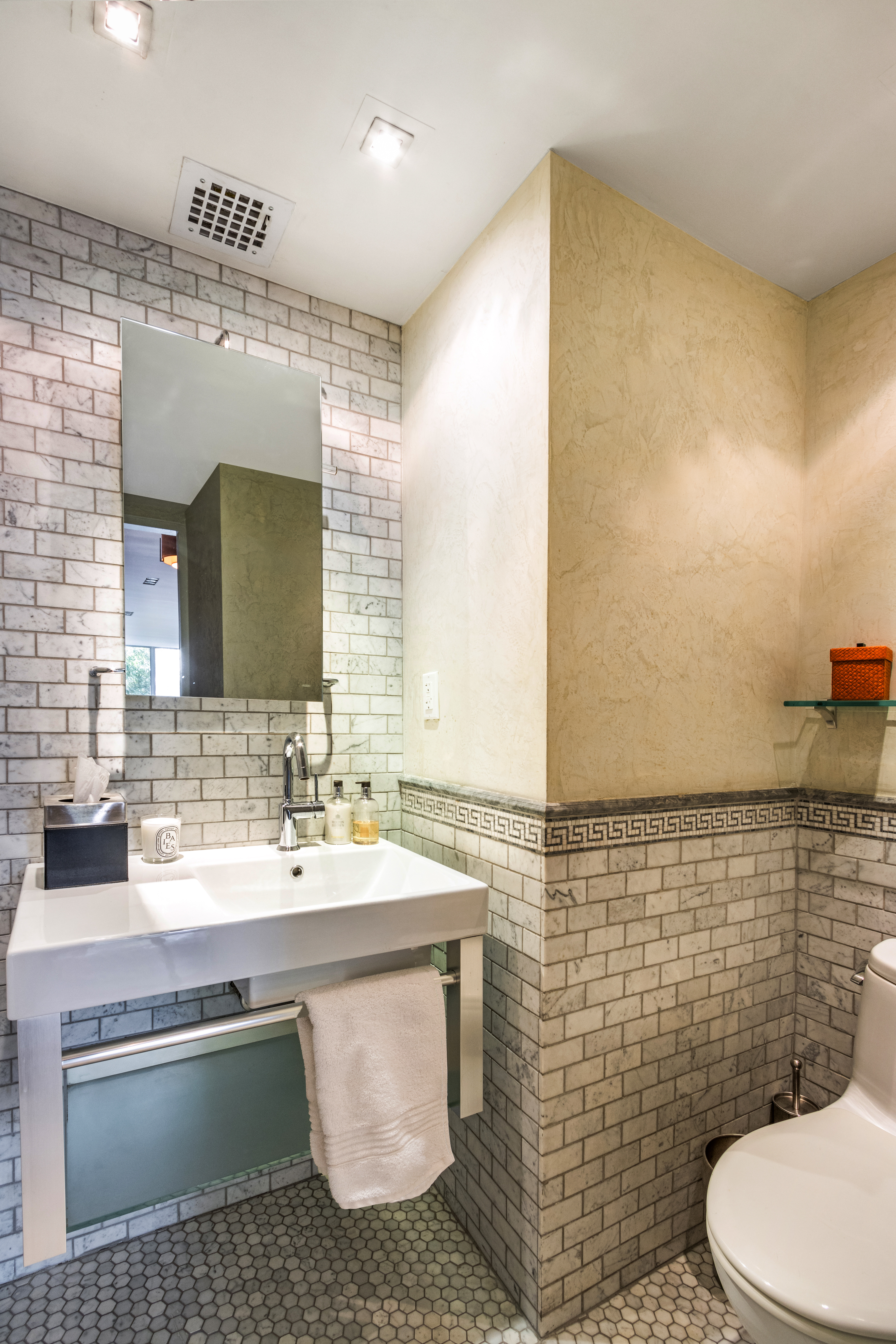 48 West 86th Street, Unit 1 Manhattan, NY 10024 - Photo 14 of 17 a bathroom with a sink toilet and mirror