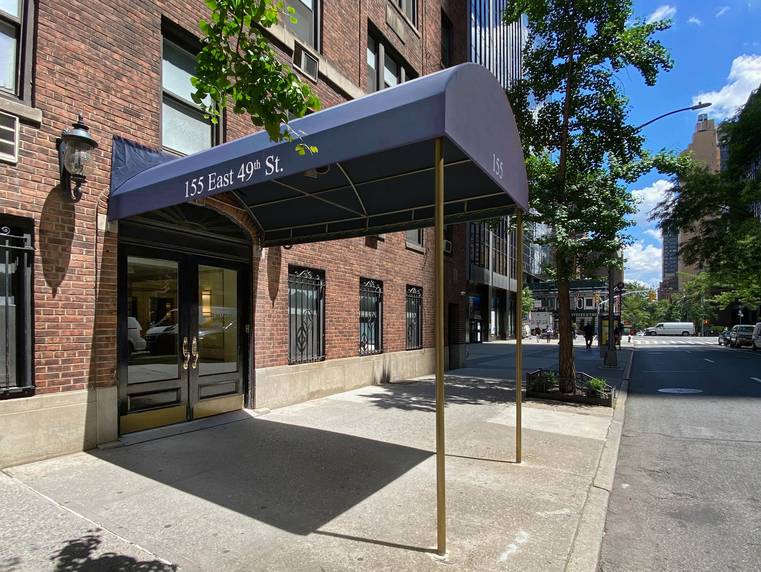 155 East 49th Street, Unit 1E Manhattan, NY 10017 - Photo 7 of 8 a view of a chairs and table in the patio