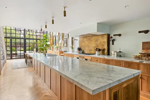 a kitchen with stainless steel appliances granite countertop a counter top and a stove