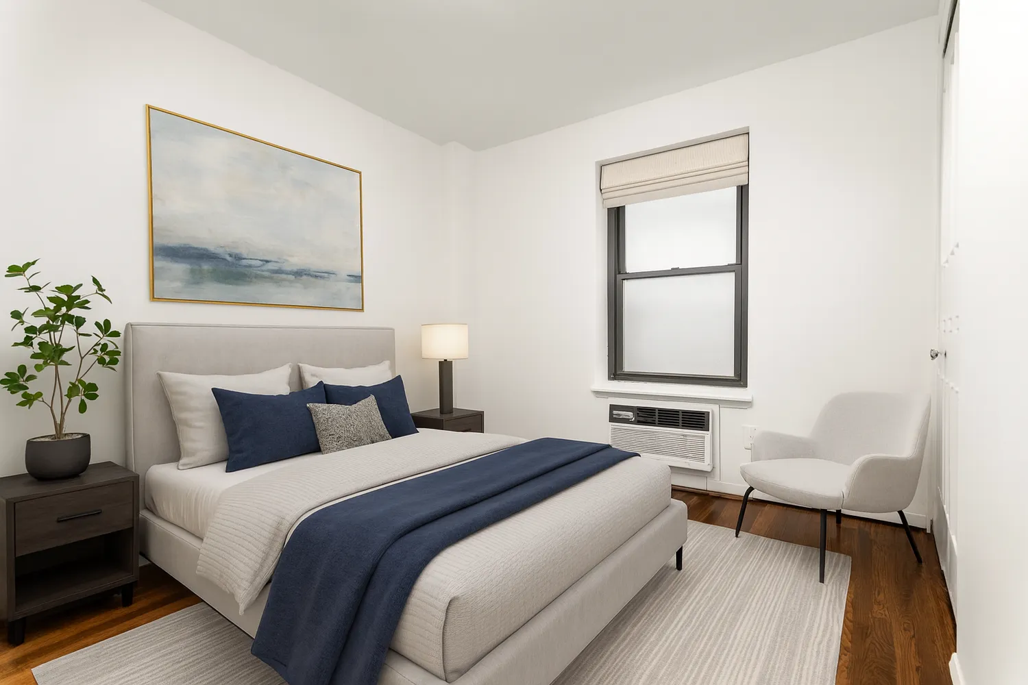 a bedroom with a bed and a painting on the wall