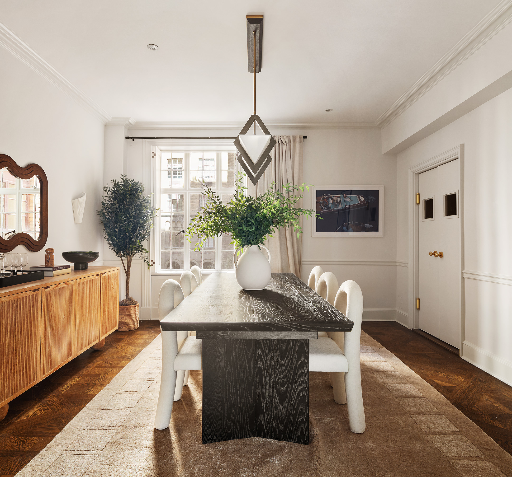 115 East 67th Street, Unit 3C Manhattan, NY 10065 - Photo 7 of 21 a dining room with furniture and window