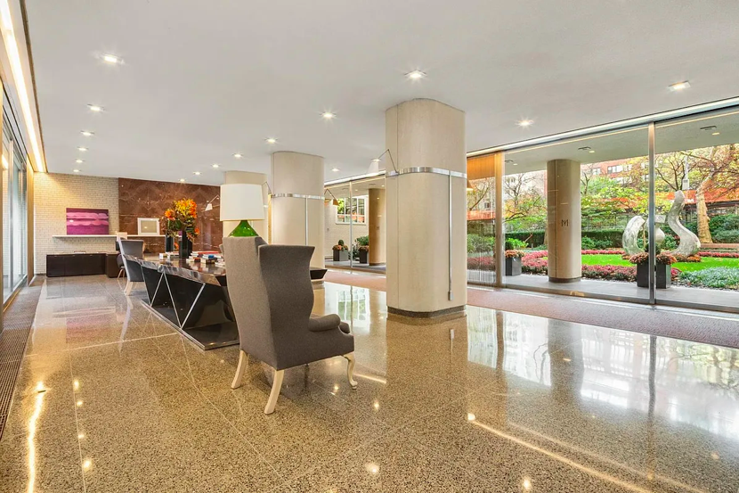 200 East 66th Street, Unit C704 Manhattan, NY 10065 - Photo 22 of 23 a view of a living room a dining room and kitchen view