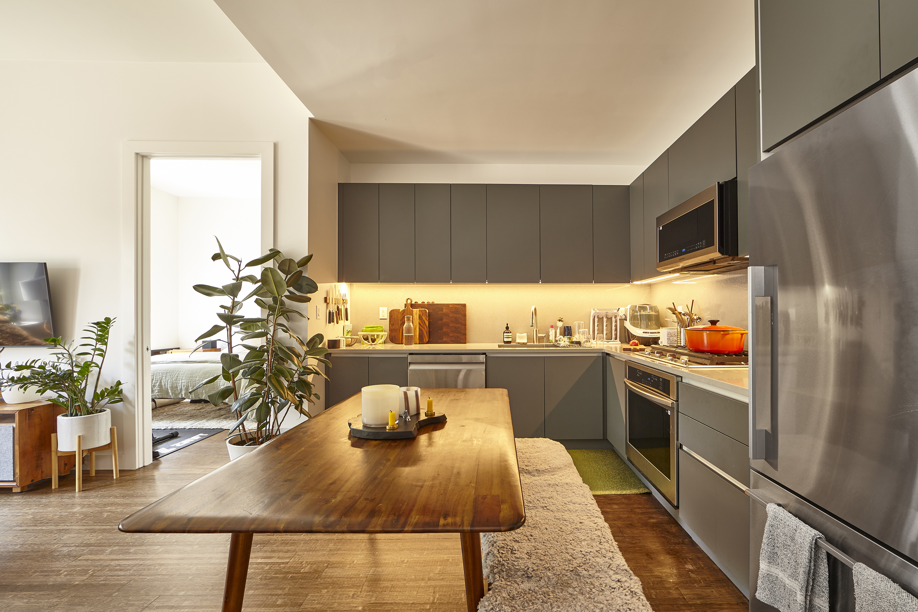 144 North 10th Street, Unit 2D Brooklyn, NY 11249 - Photo 1 of 12 a kitchen with stainless steel appliances granite countertop sink stove and refrigerator