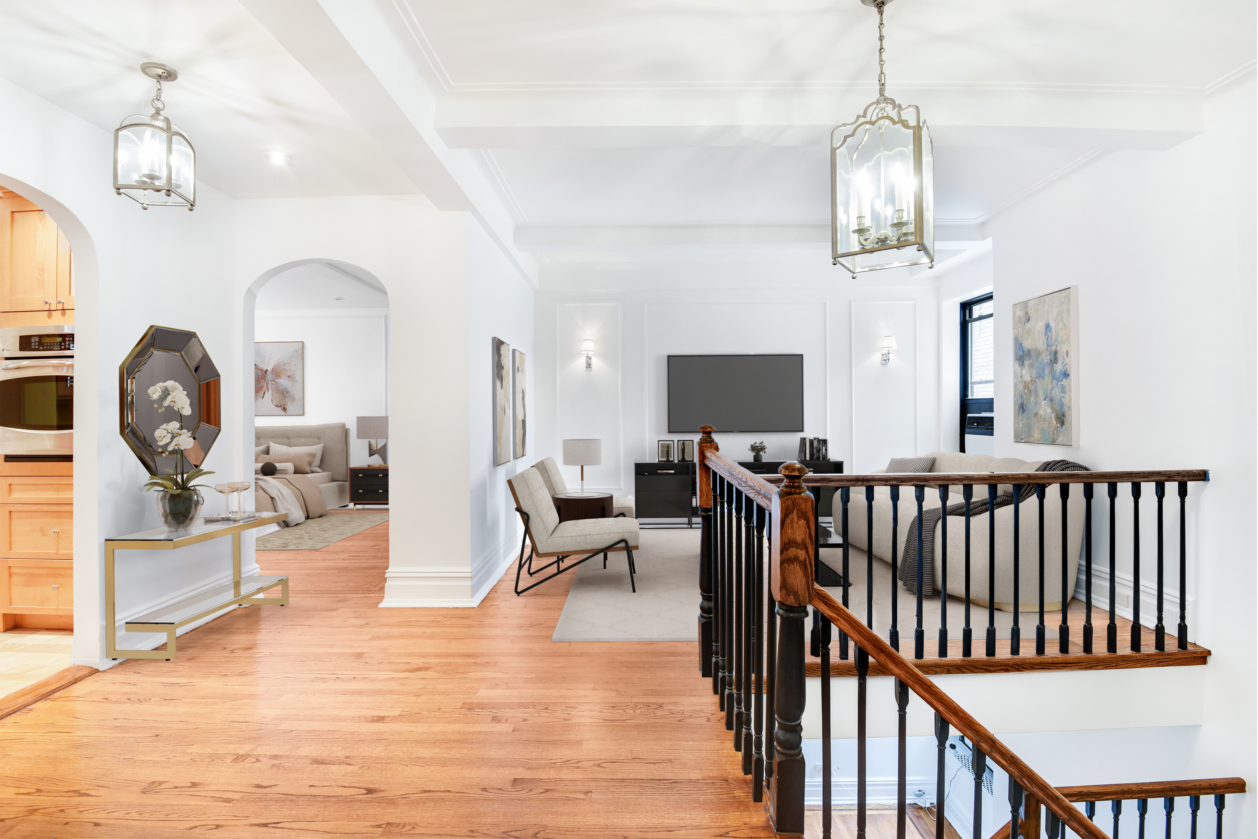 a view of a livingroom with furniture windows wooden floor and a chandelier