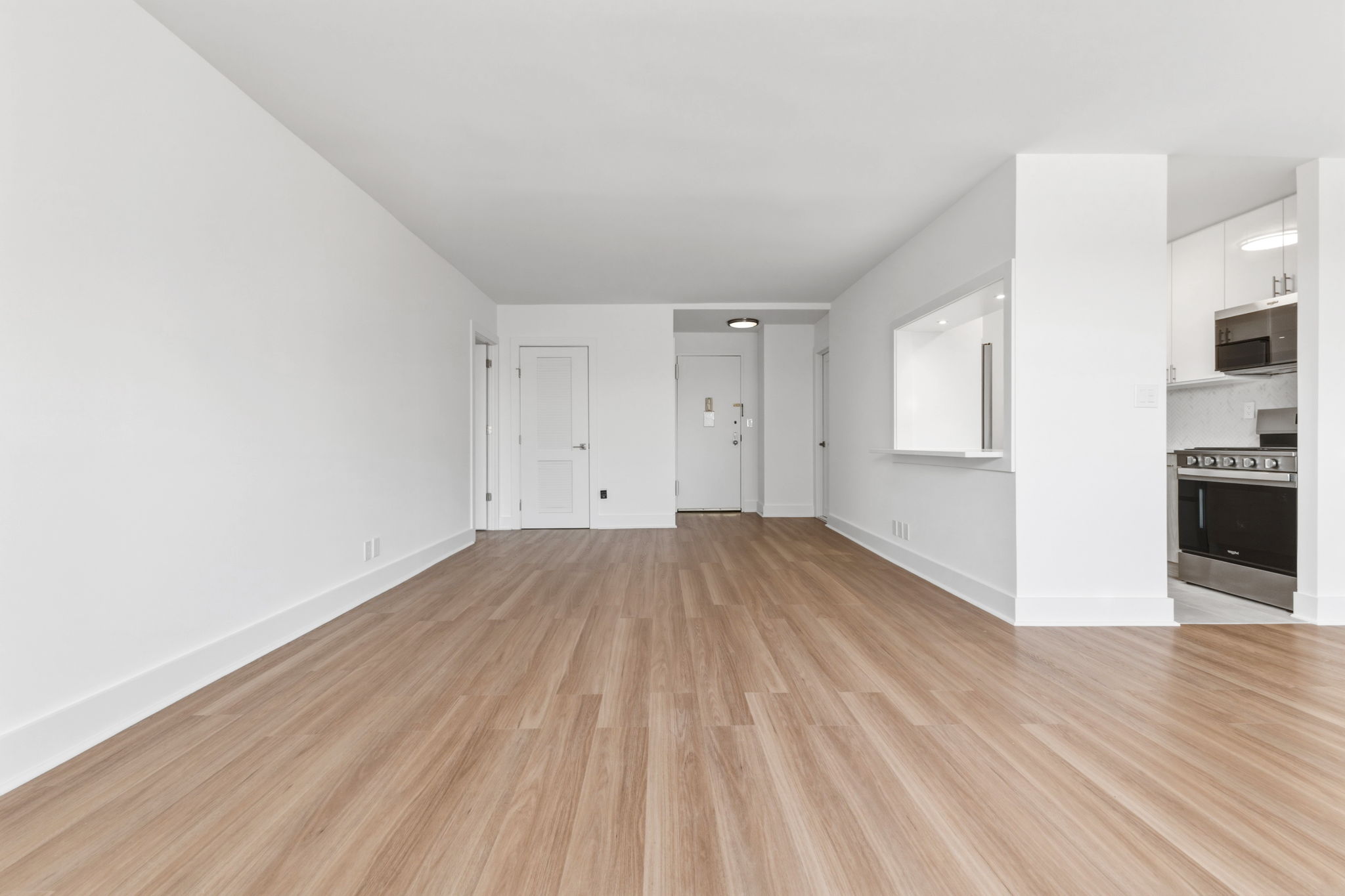 400 East 54th Street, Unit 24E Manhattan, NY 10022 - Photo 11 of 29 a view of a room with wooden floor and a sink