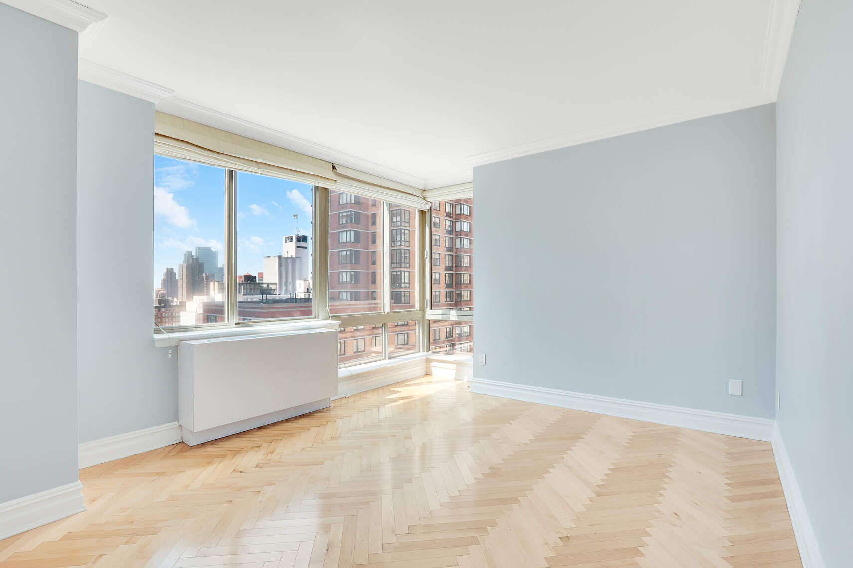 2 Columbus Avenue, Unit 17C Manhattan, NY 10023 - Photo 15 of 26 a large white room with a large window