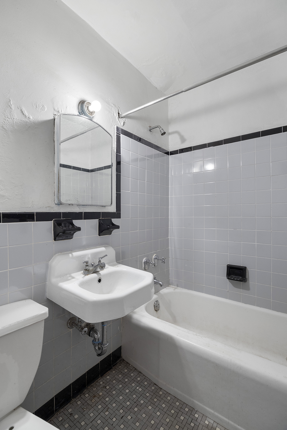 105 Ashland Place, Unit 5E Brooklyn, NY 11201 - Photo 11 of 17 a bathroom with a sink toilet and shower