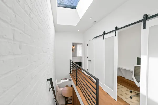 a bathroom with a mirror and a shower