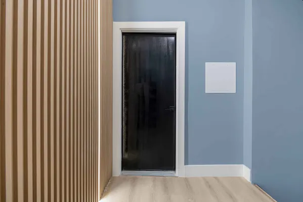 a view of a hallway with a wooden floor