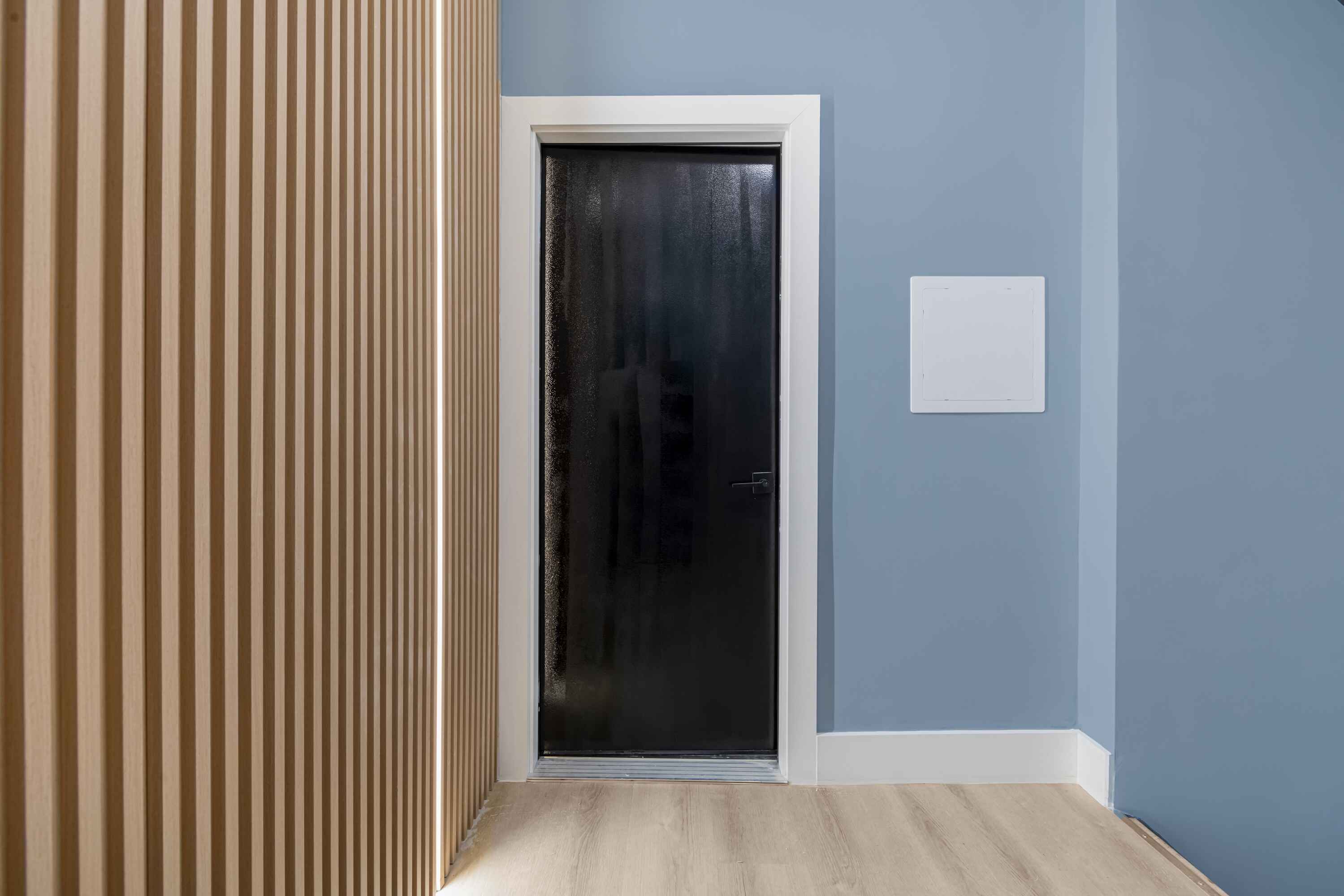 23-13 Steinway Street, Unit 2F Queens, NY 11105 - Photo 9 of 10 a view of a hallway with a wooden floor