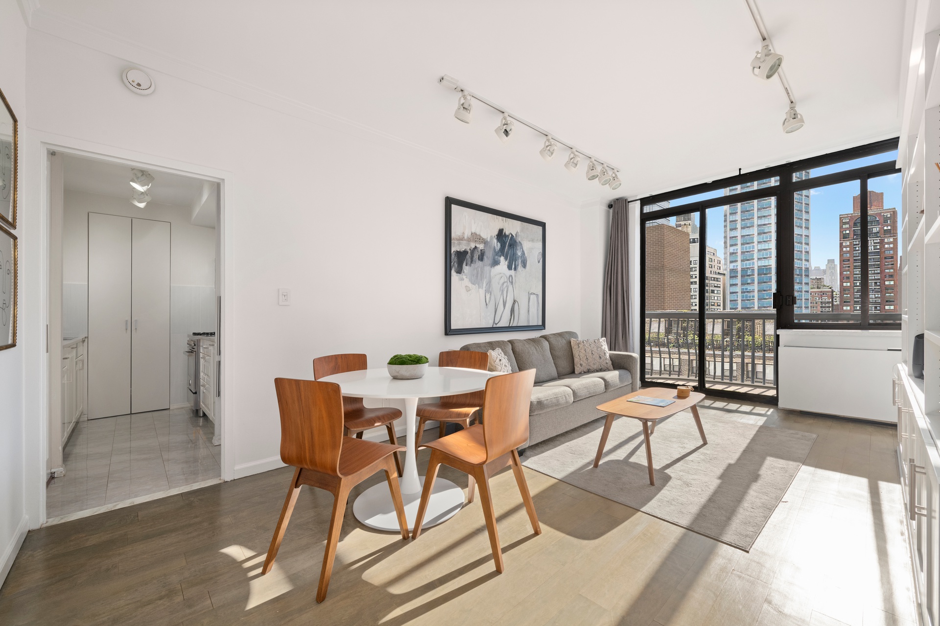 343 East 74th Street, Unit 14K Manhattan, NY 10021 - Photo 1 of 7 a view of a livingroom with furniture window and outside view