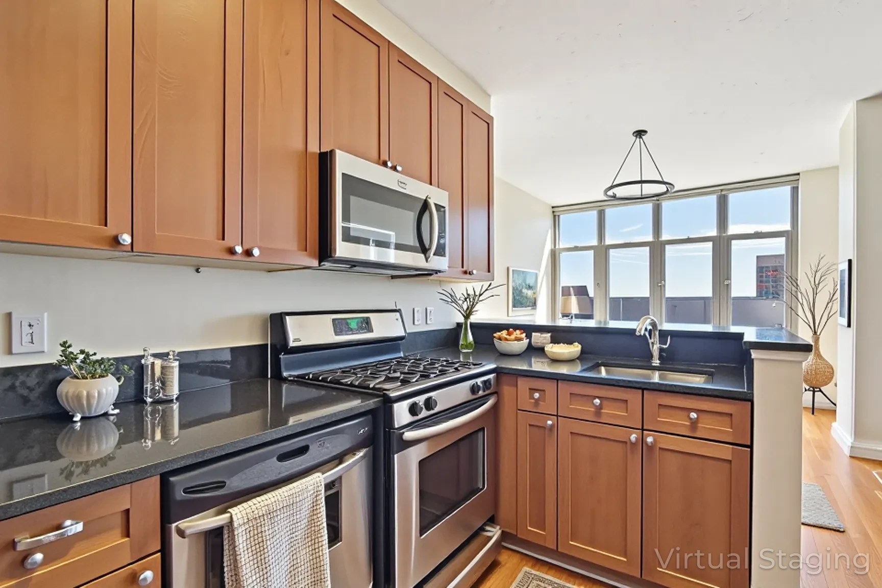 2120 Vermont Avenue Northwest, Unit 620 Washington, DC 20001 - Photo 7 of 61 a kitchen with stainless steel appliances granite countertop a stove a sink and a microwave