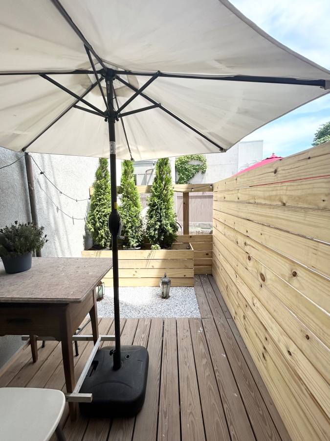 409 Smith Street, Unit 1 Brooklyn, NY 11231 - Photo 9 of 9 a view of a balcony with chairs and wooden floor