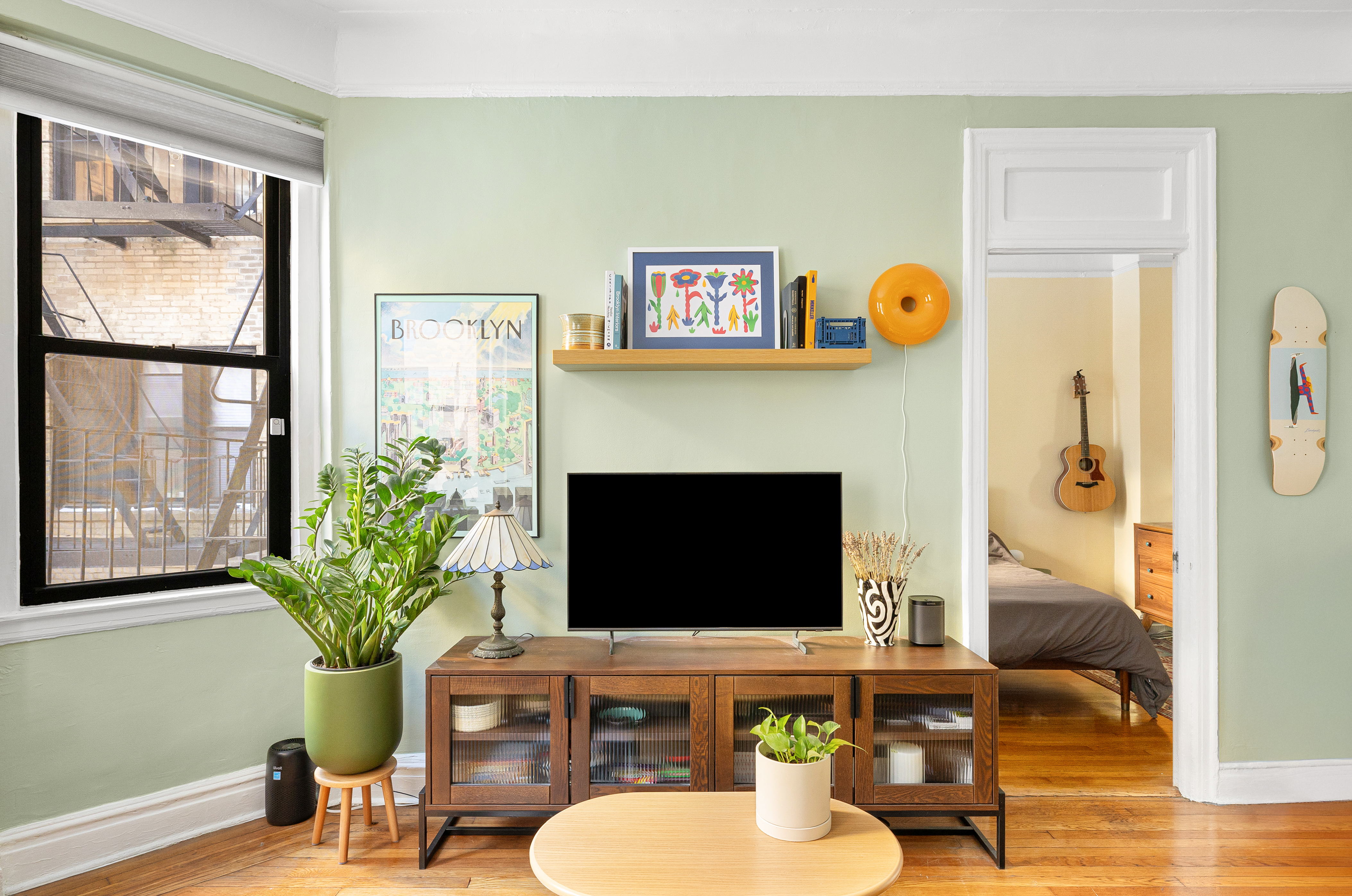 78 8th Avenue, Unit 2K Brooklyn, NY 11215 - Photo 8 of 10 a living room with furniture potted plant and a fireplace