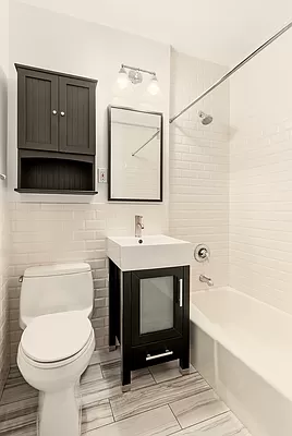 55 West 83rd Street, Unit GARDEN Manhattan, NY 10024 - Photo 4 of 6 a bathroom with a toilet a sink and bathtub