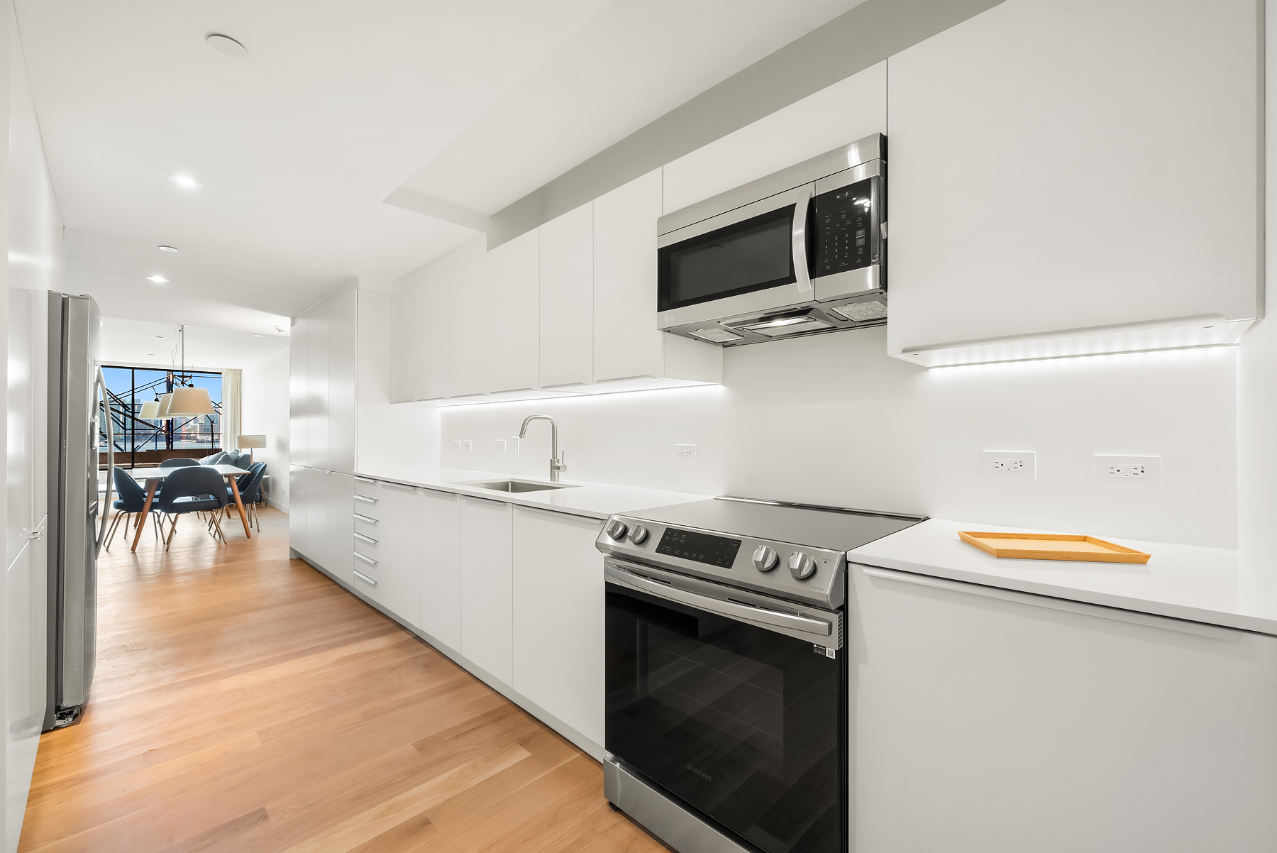 479 Washington Street, Unit 4 Manhattan, NY 10013 - Photo 3 of 8 a kitchen with a stove and a microwave