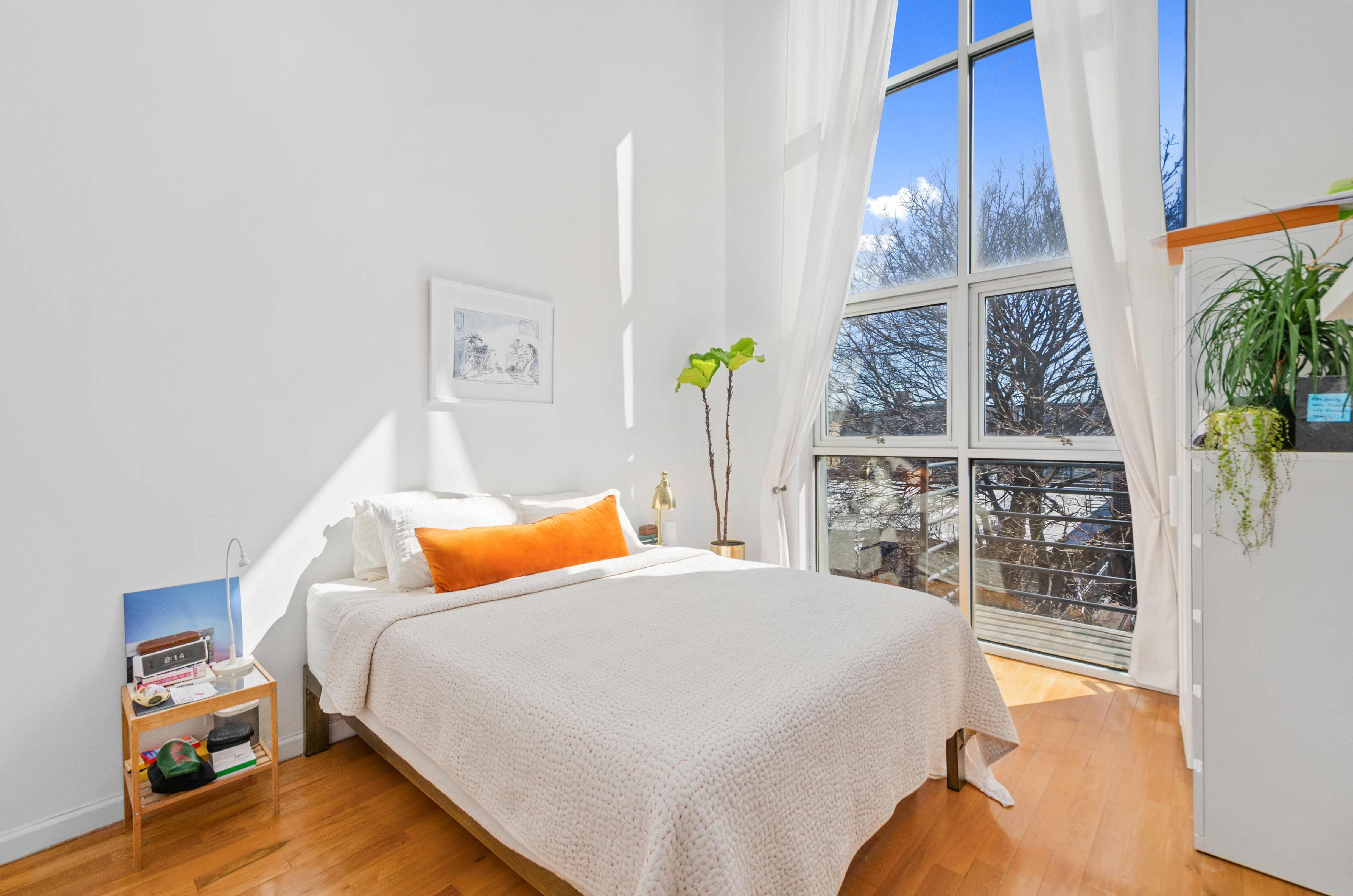 84 Eagle Street, Unit 2D Brooklyn, NY 11222 - Photo 5 of 10 a bedroom with a bed and wooden floor